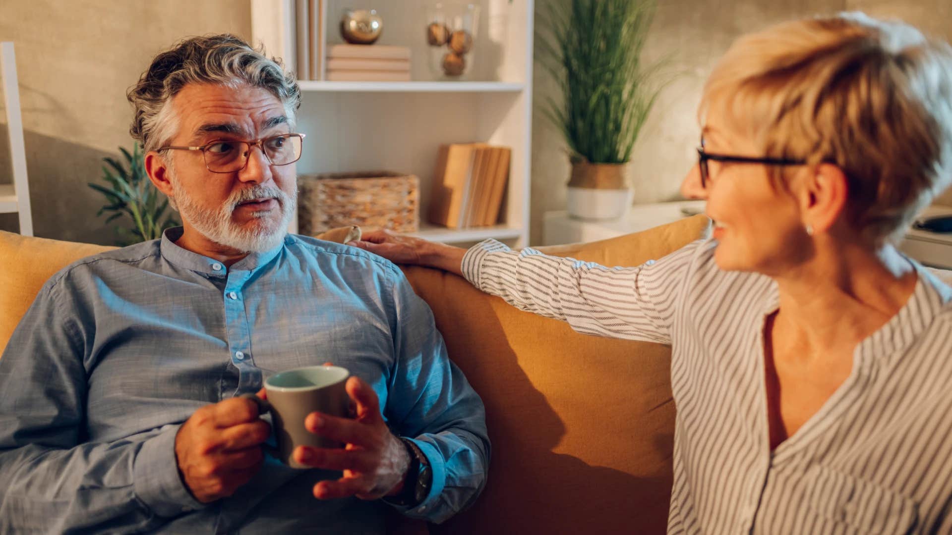 man not raising his voice while speaking with partner