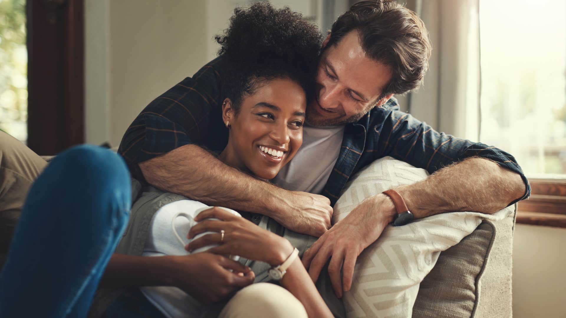 man hugging partner loving her unconditionally