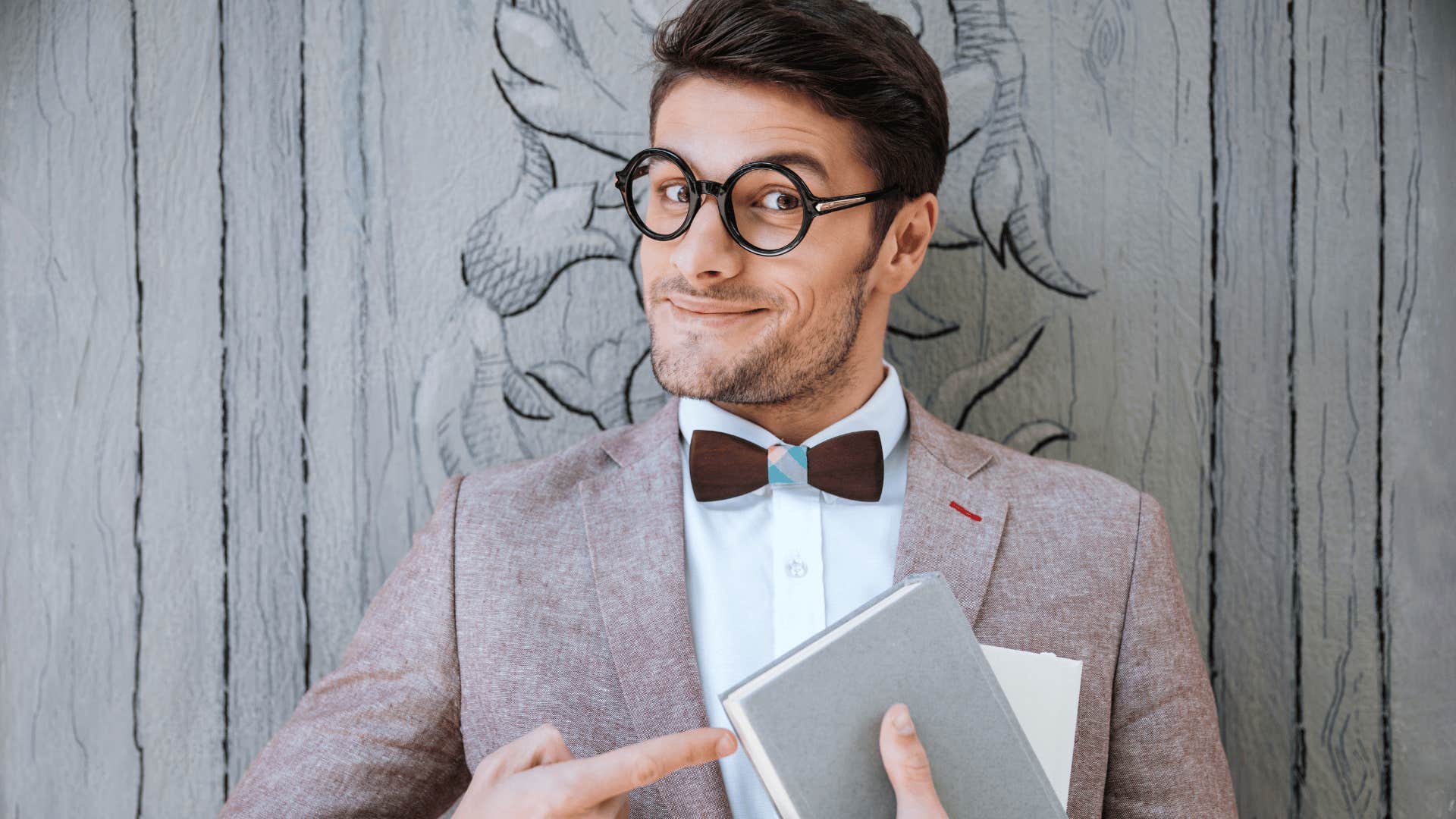 MAn whose parents raised him well hold book