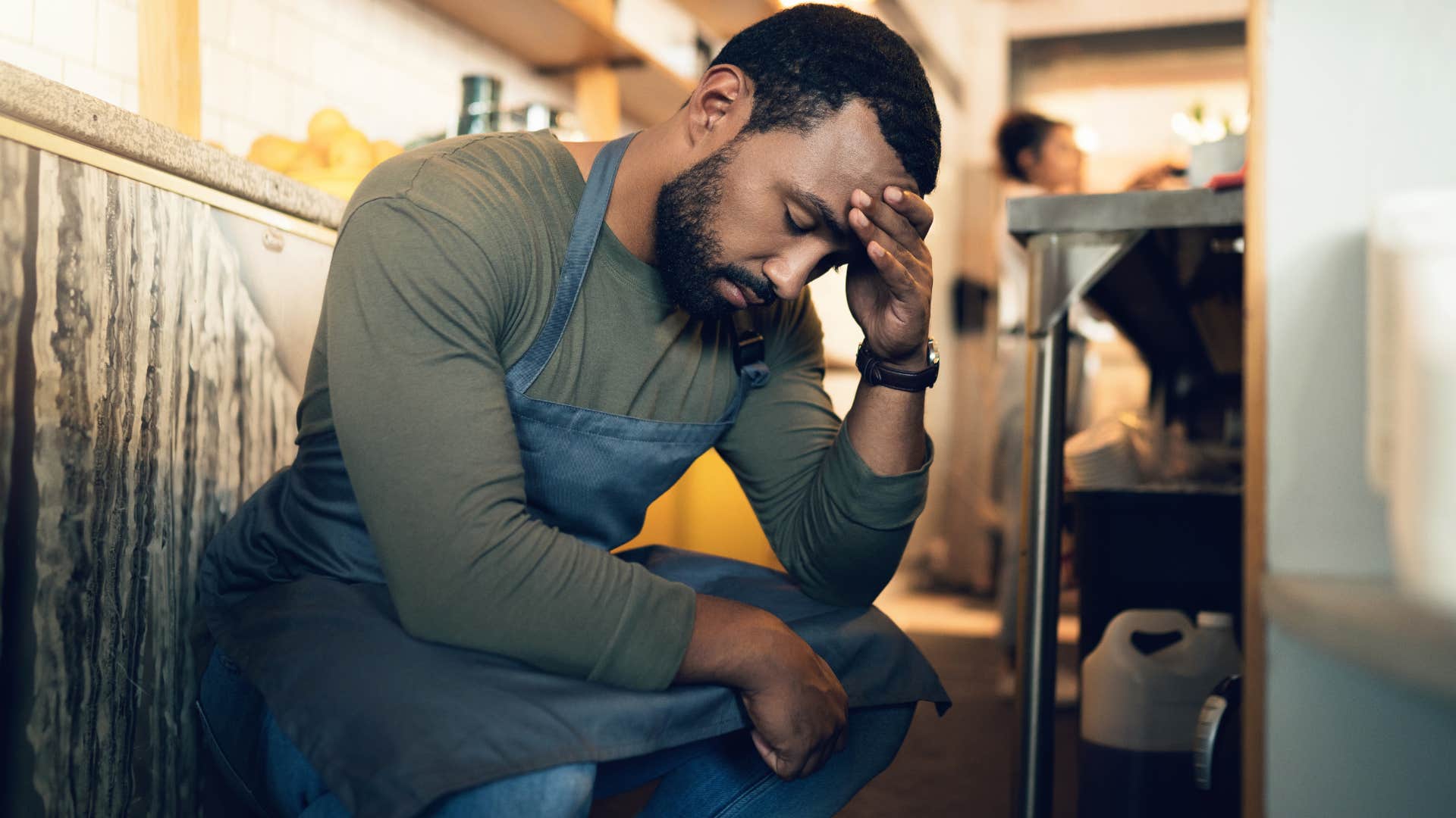 service worker stressed out after arguing with customer