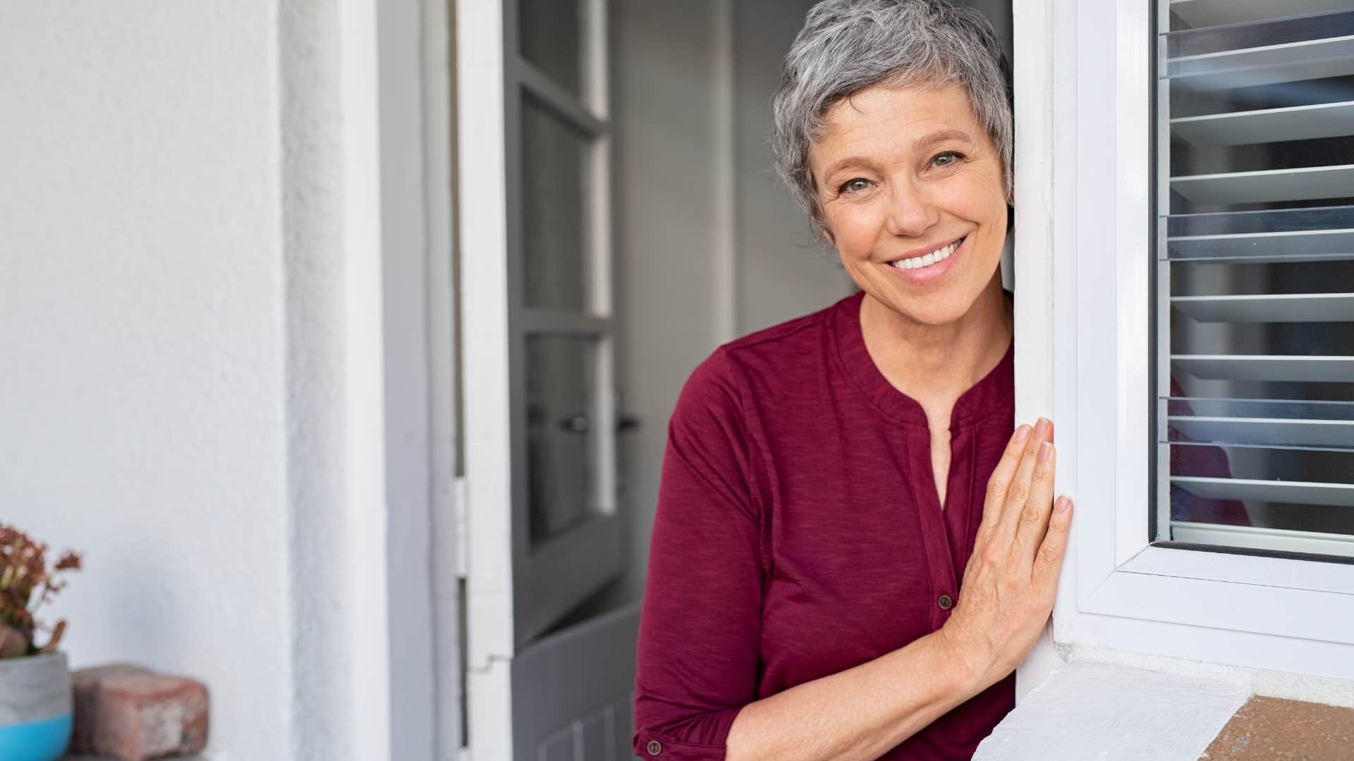 boomer woman smiling after stopping by unannounced