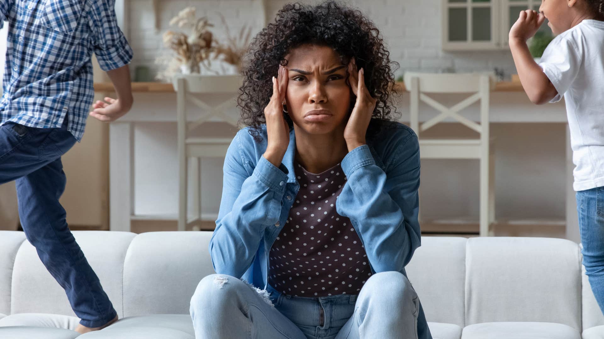 broke woman stressed with watching her kids