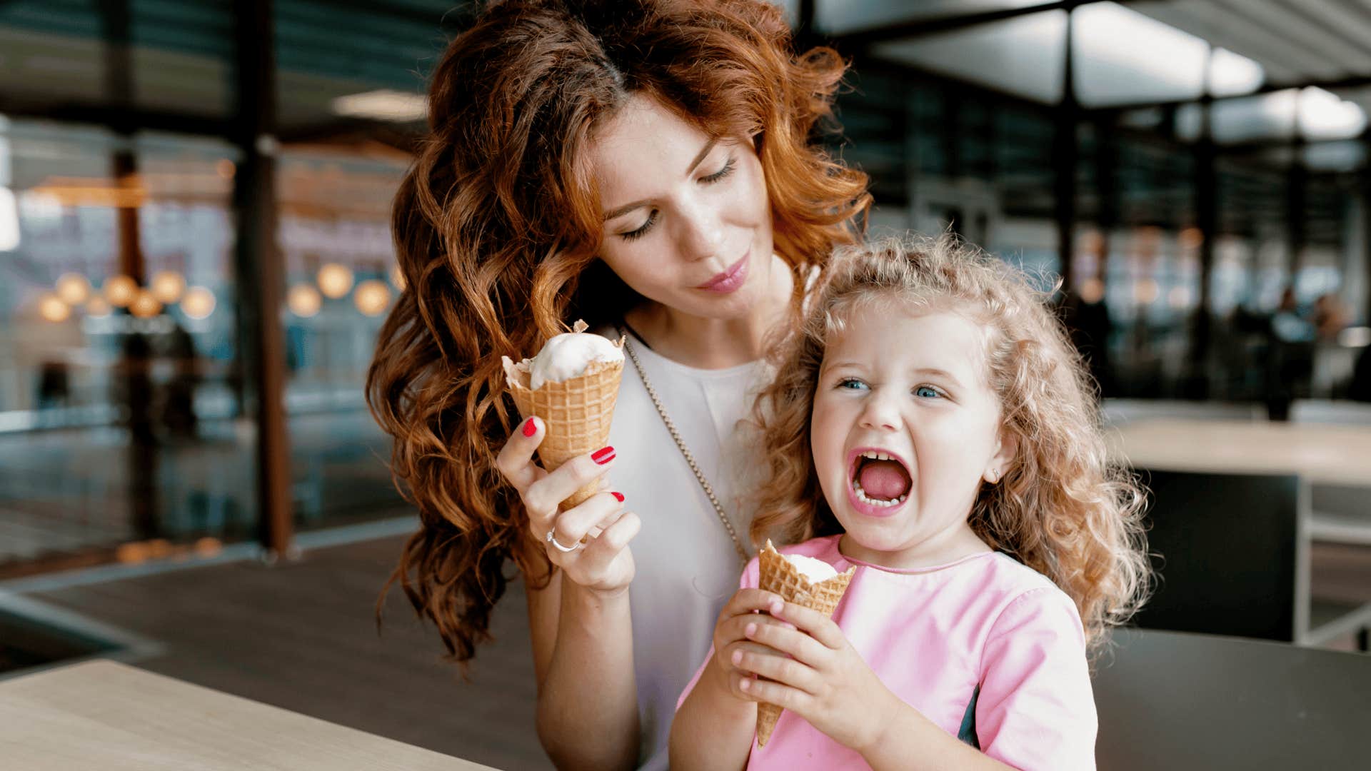 well-meaning mother holding screaming baby