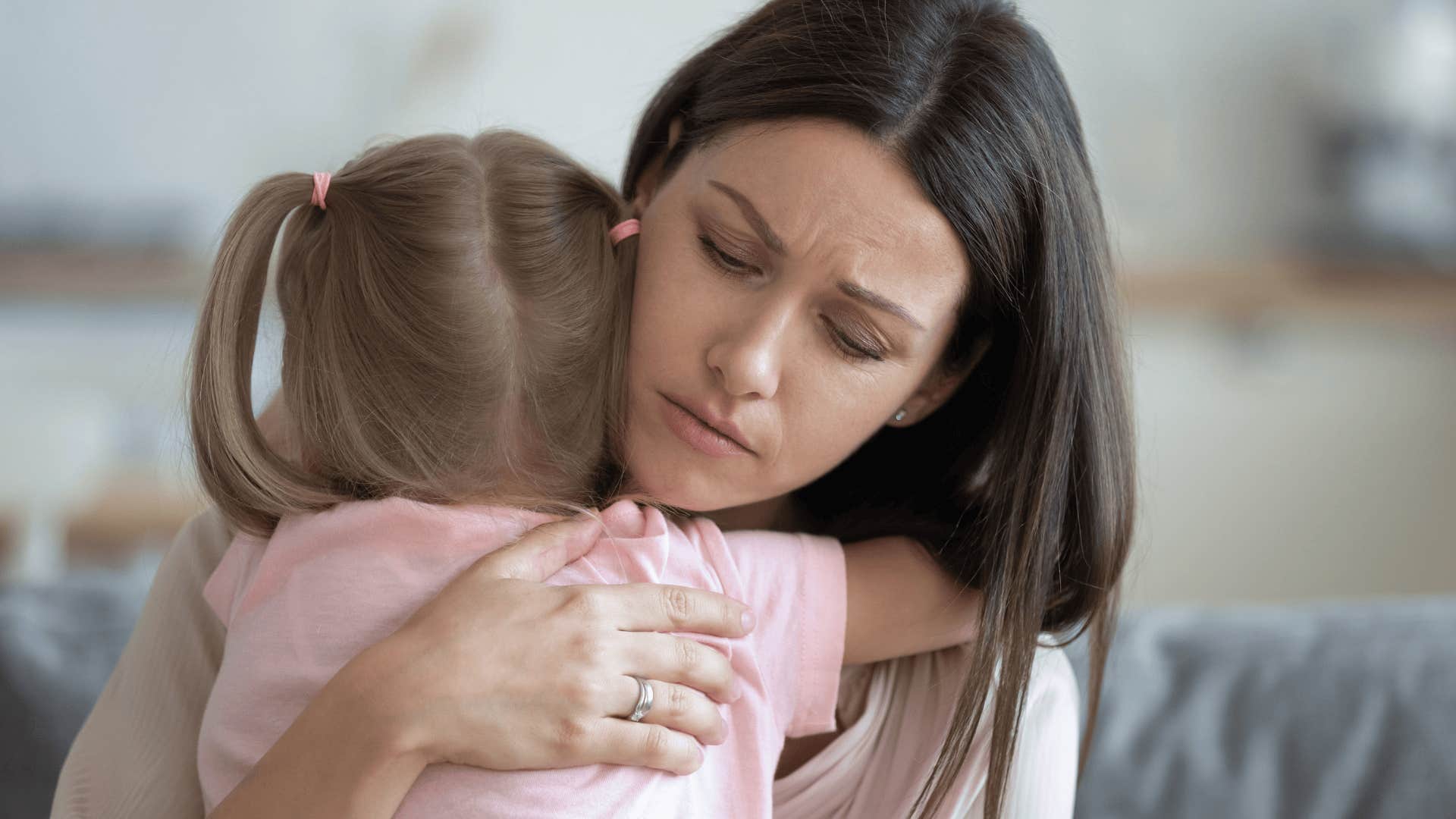 well-meaning mother hugging her child