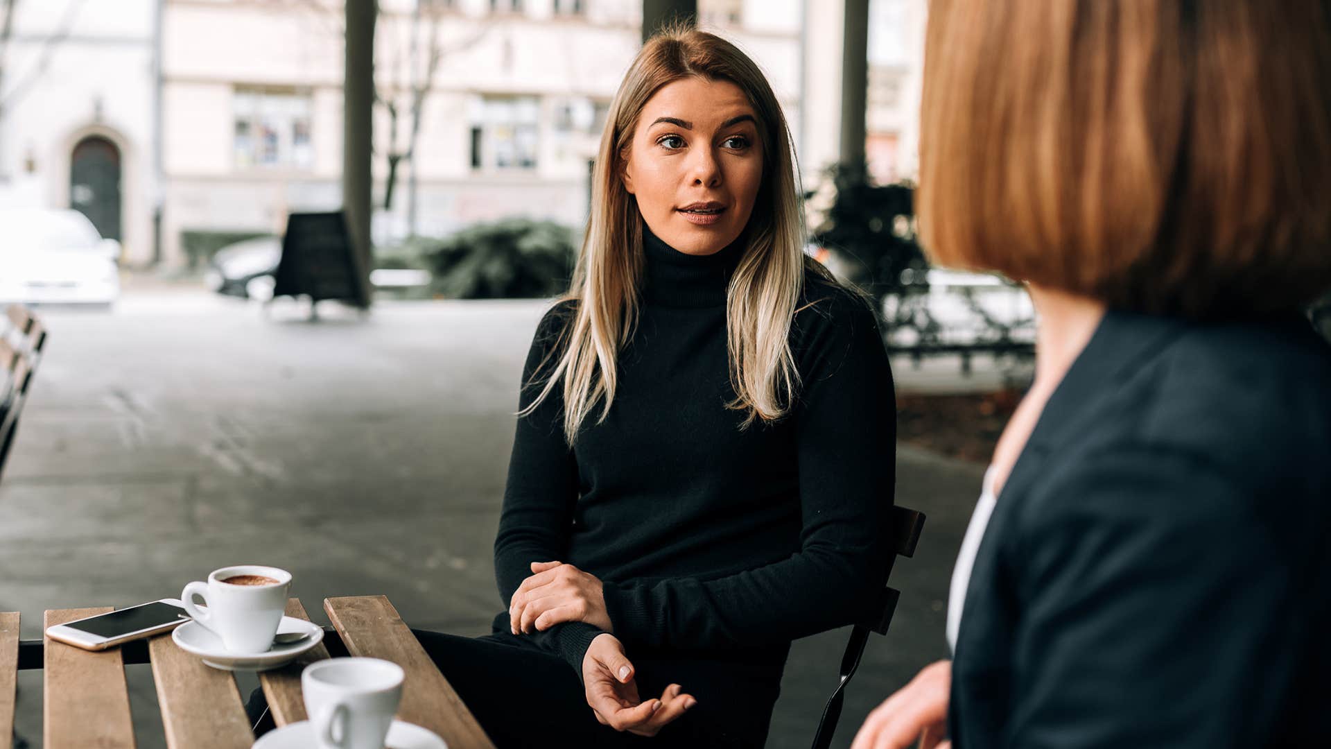 Woman who doesn't argue to be right talking to another person.