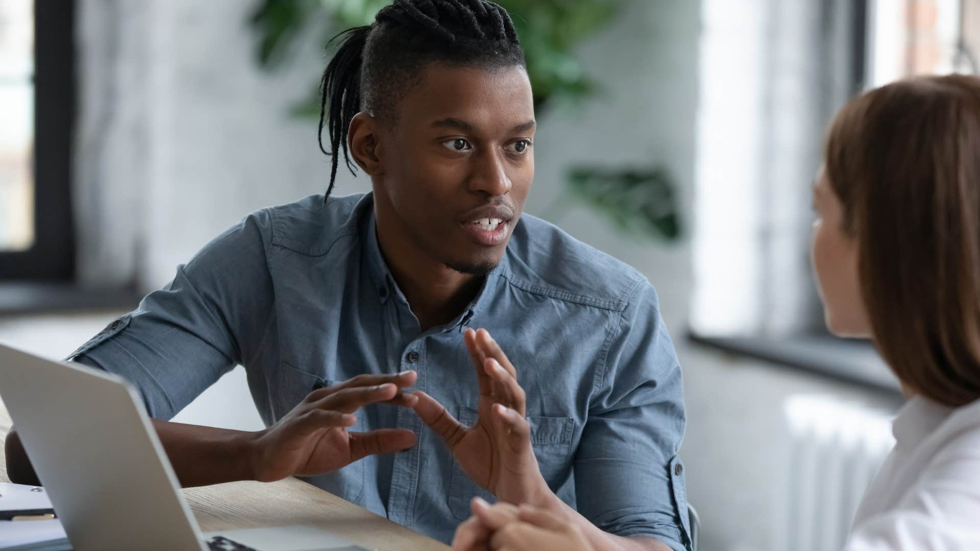 Man who's not afraid to set boundaries talking to a co-worker.