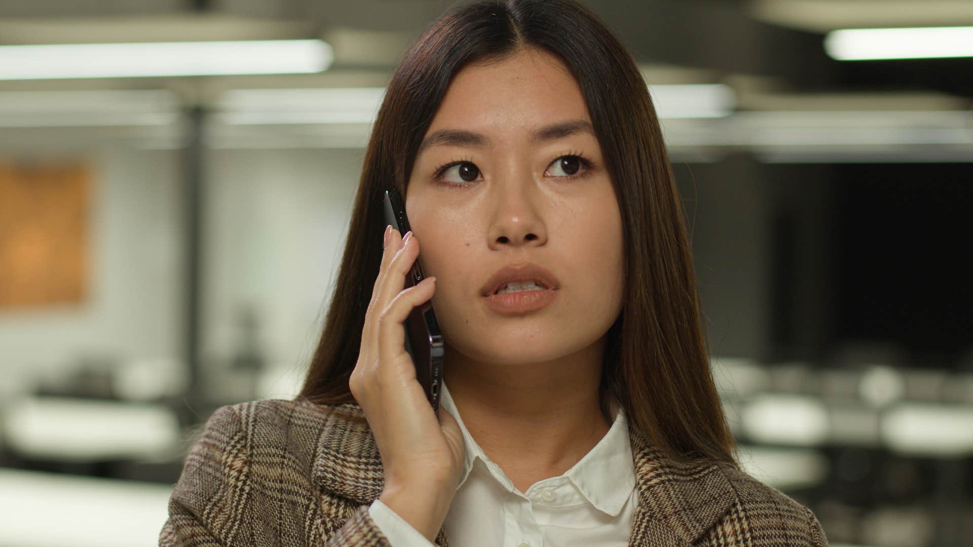 Woman who's comfortable saying "no" talking on the phone.
