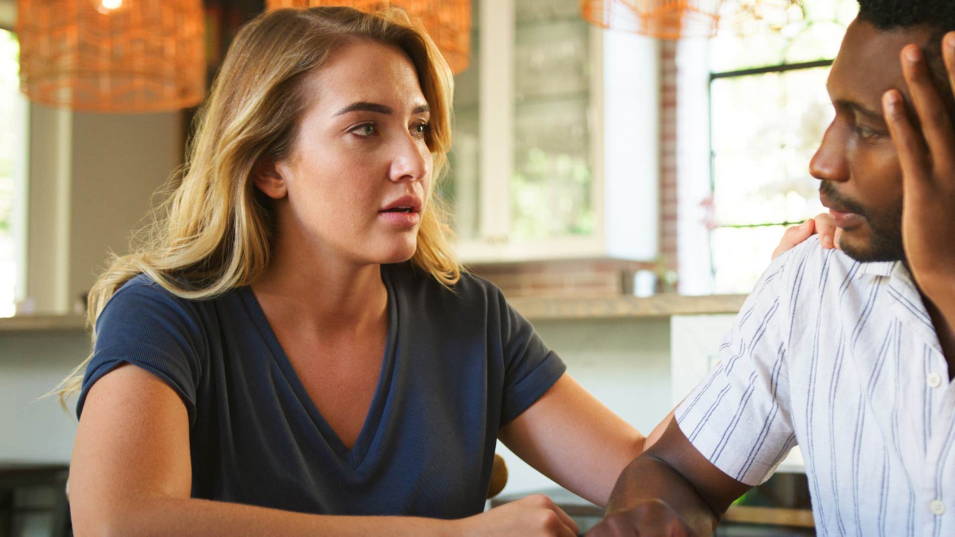 Woman who acts on red flags early talking to her partner.