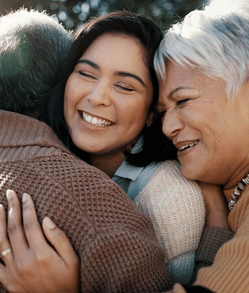 Woman hugs parents who taught life lesson of kindness
