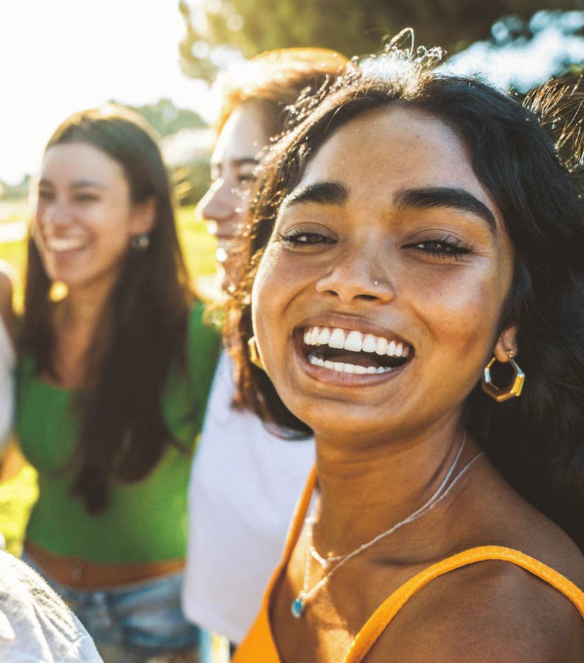 Smiling woman was taught the timeless lesson of being present with friends