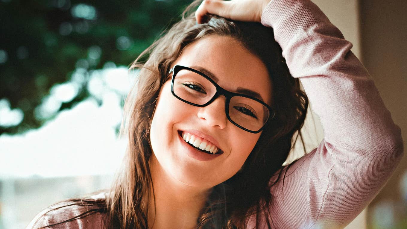 Tiny Habits That Can Help You Enjoy Life Instead Of Trying To Escape It Woman enjoying life instead of escaping it