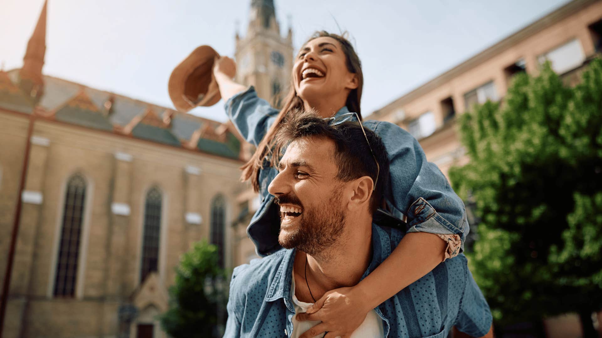 woman on man's back because she snagged the best husband