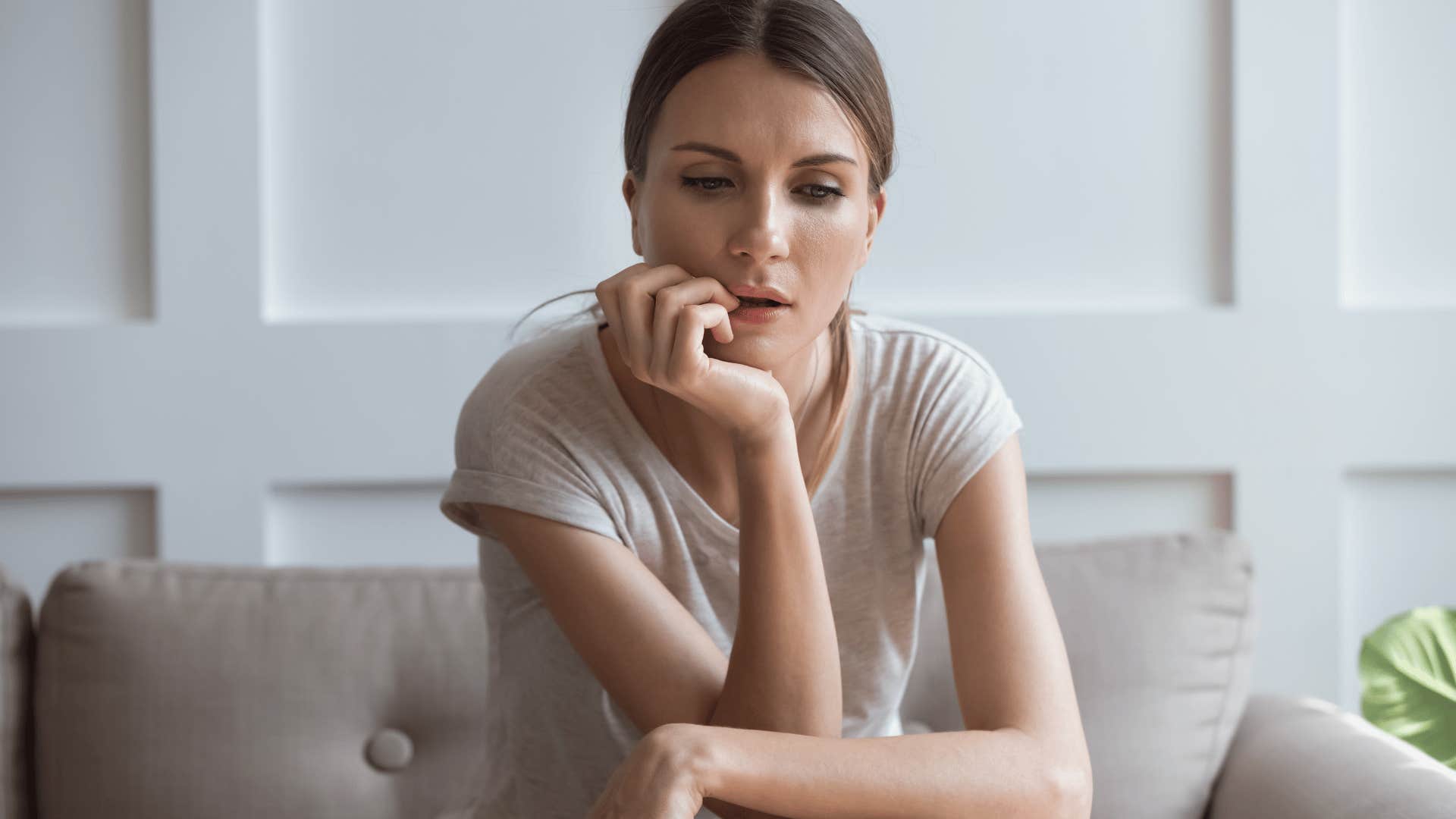 jealous woman sitting on couch