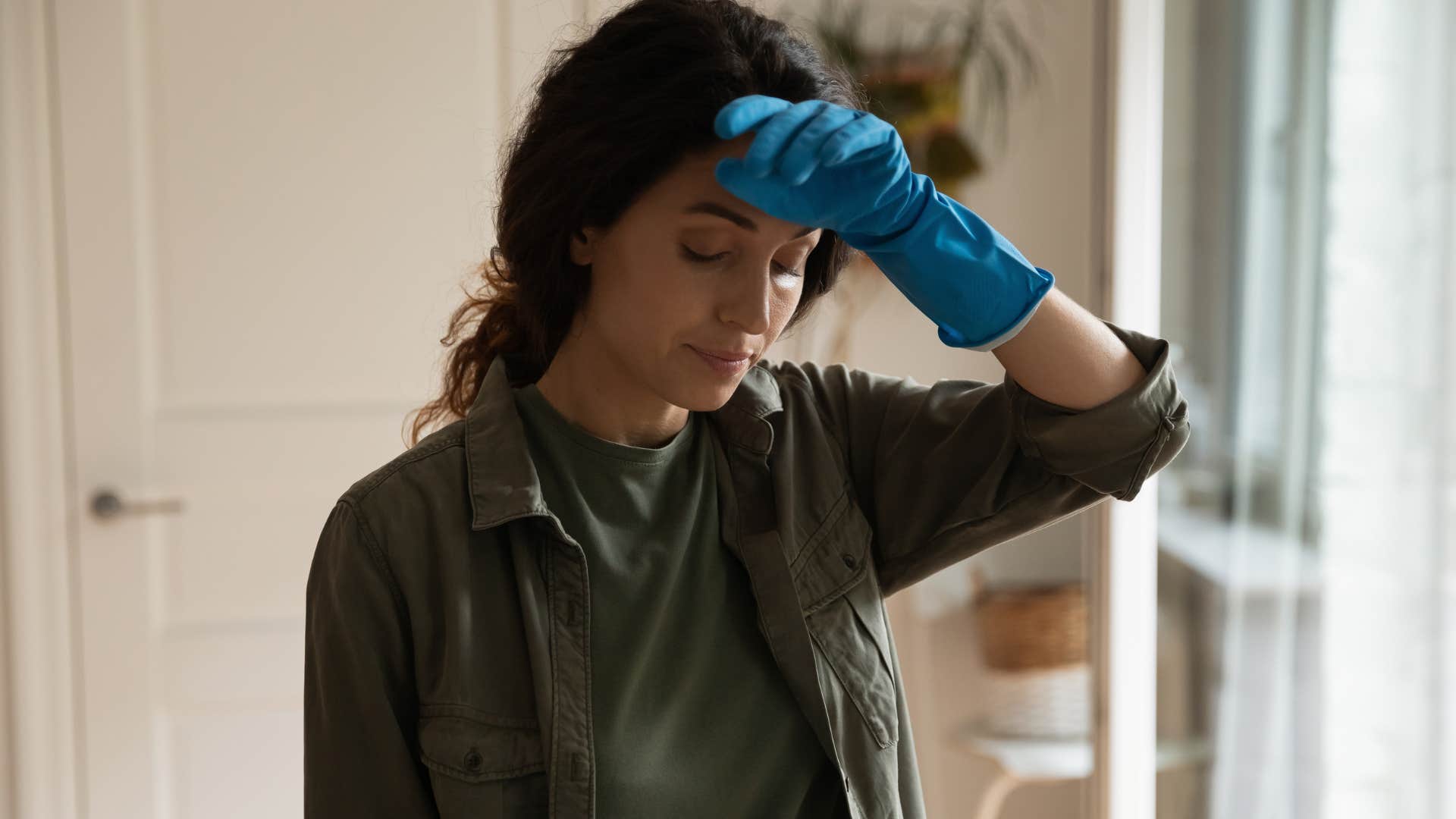 Woman who knows there's no prize for doing everything right looking tired.