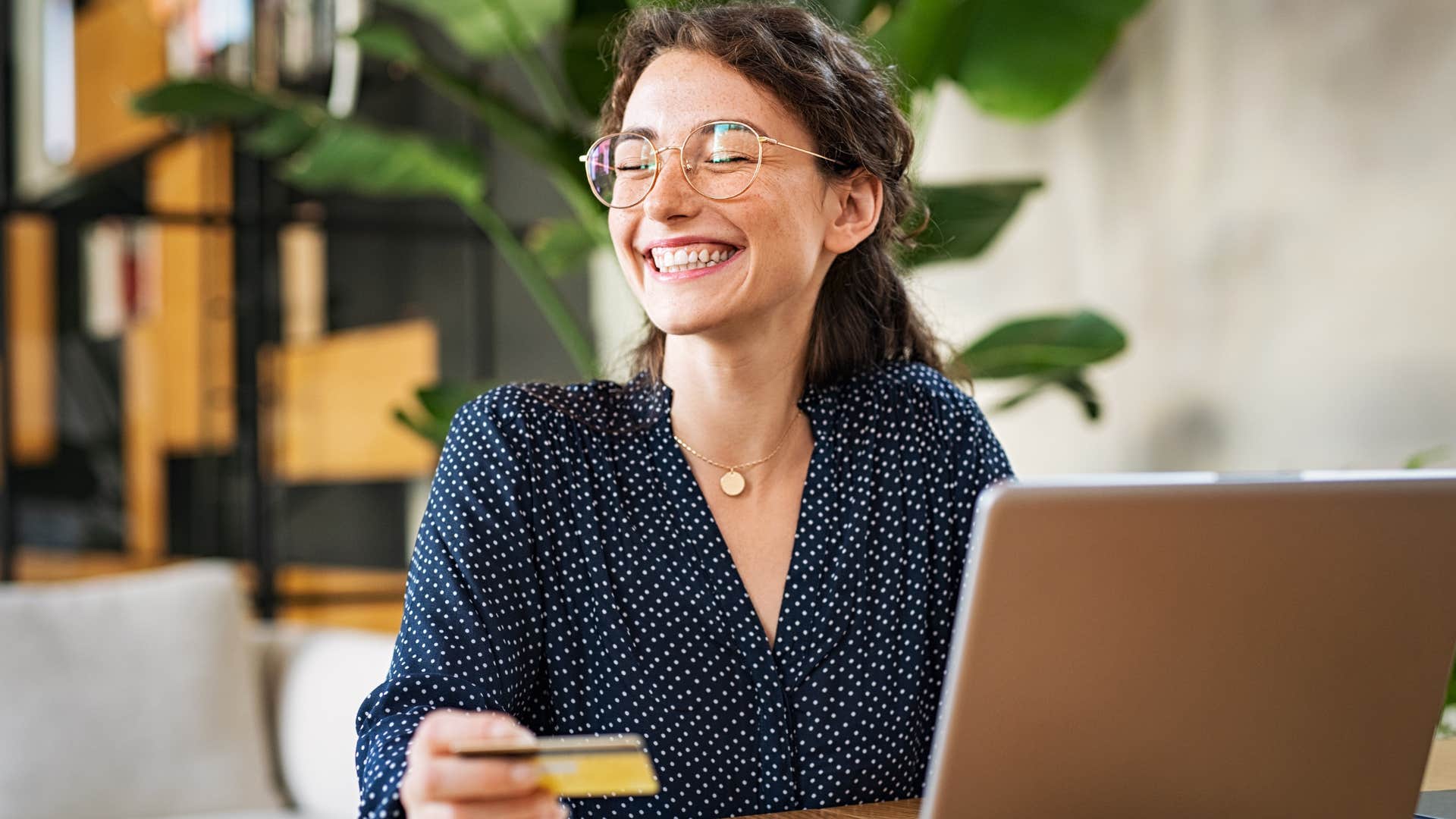 Woman who knows that financial literacy is the key to comfort doing bills.