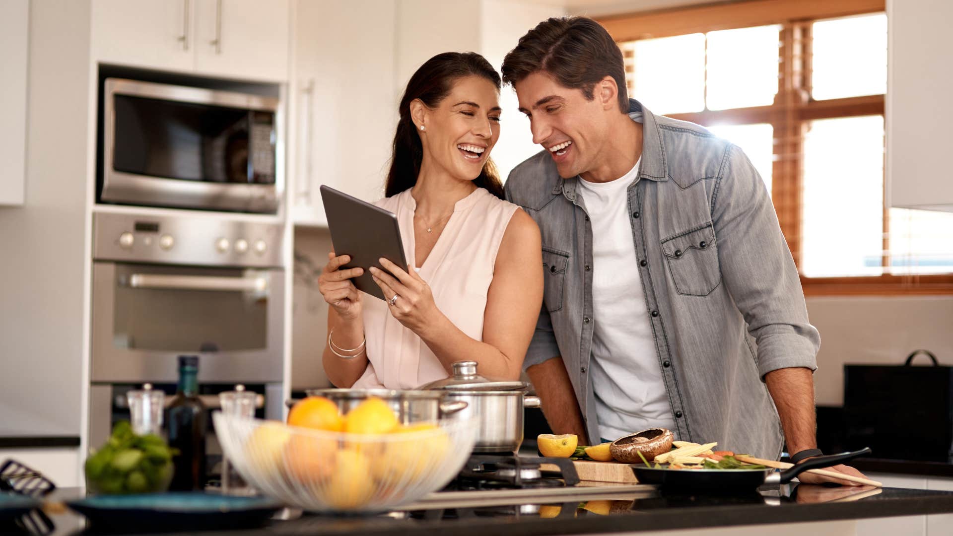 couple cooking together as romantic gesture