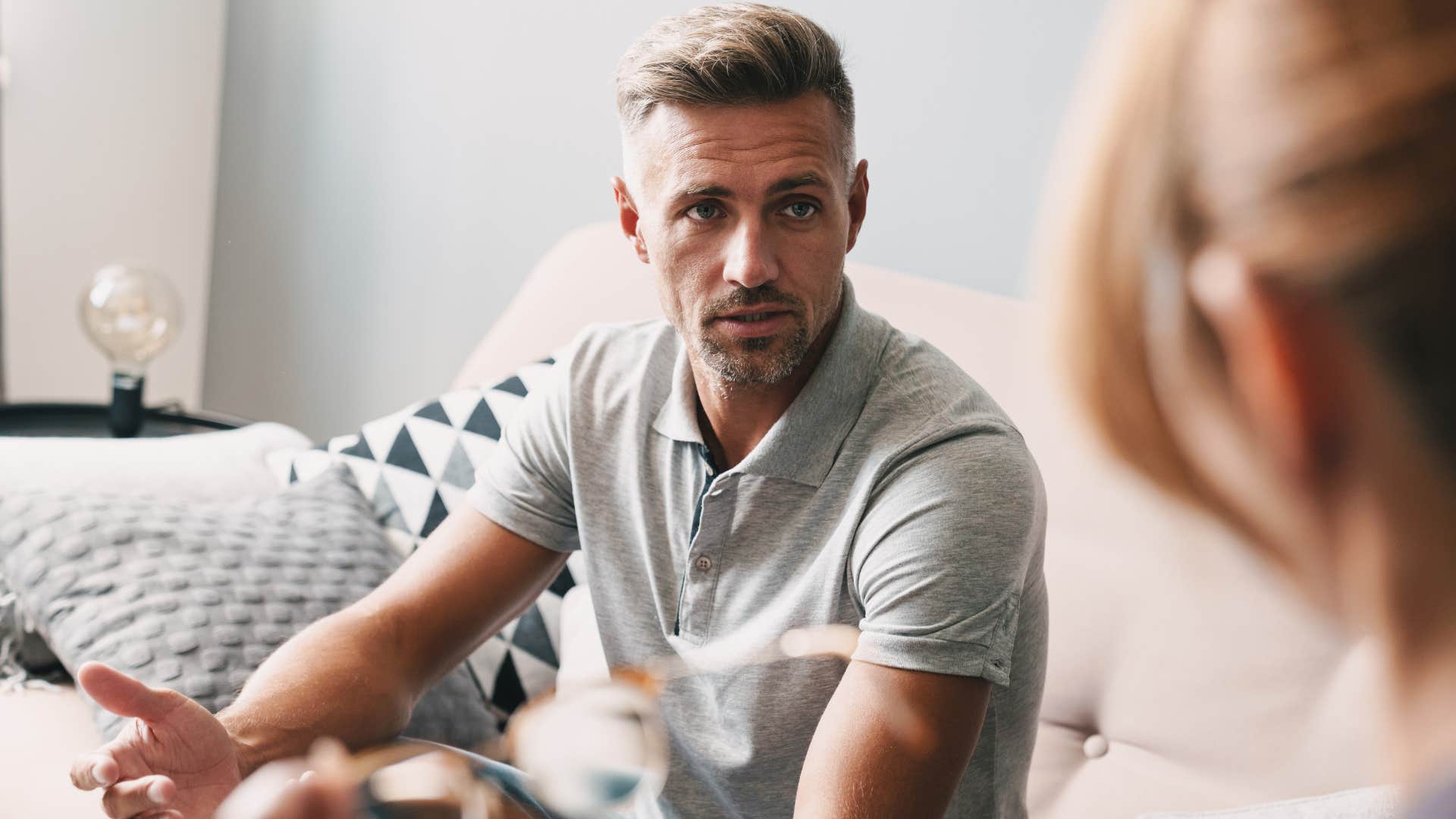 upset man feeling pressured to give up his personal interests to make woman happy