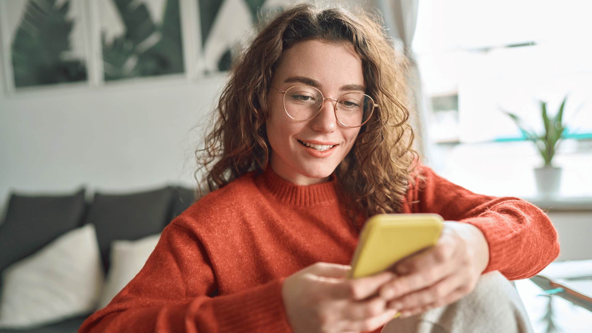 woman on phone deleting social media 