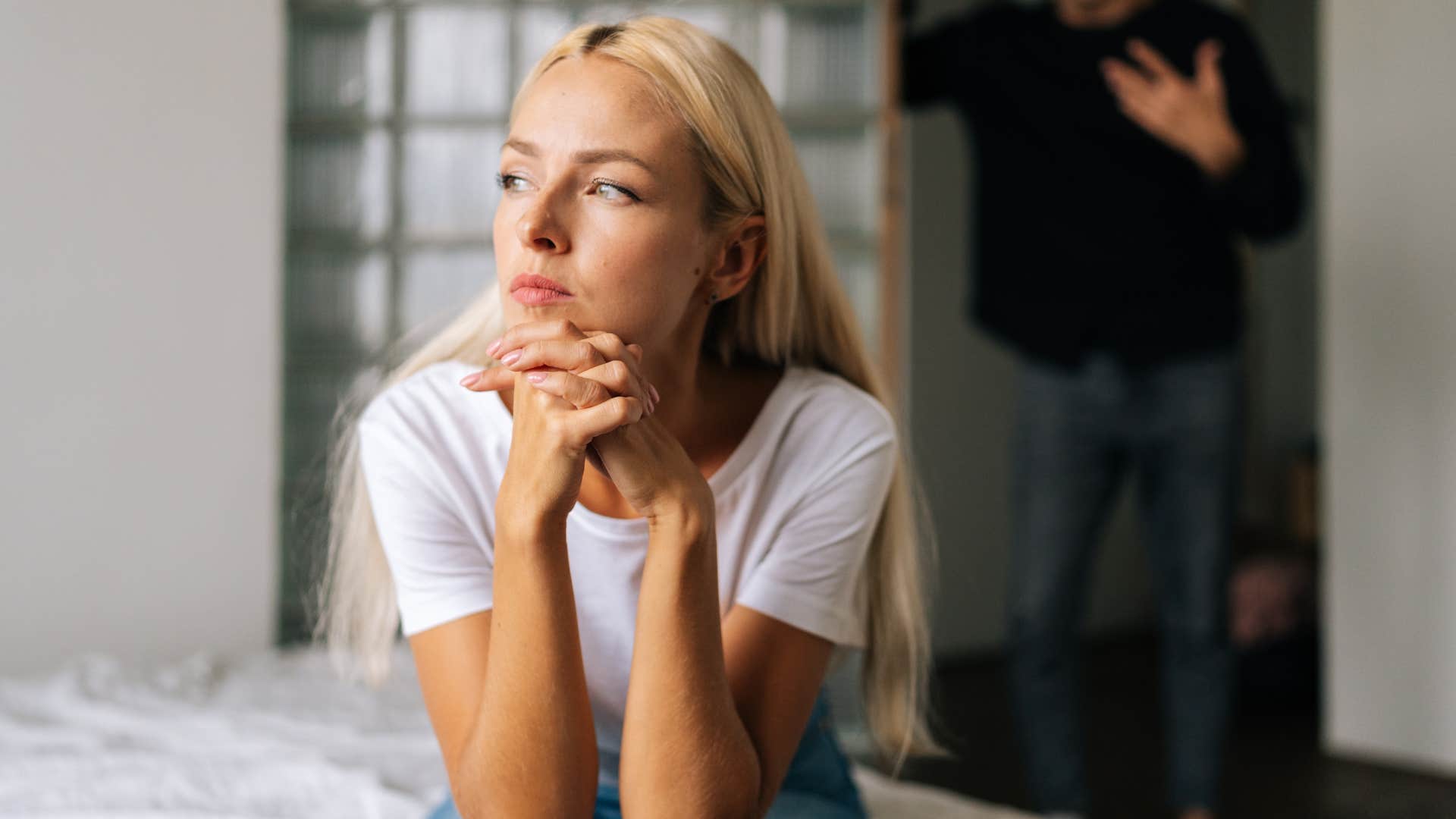 upset wife who acts different in public turned away from her husband