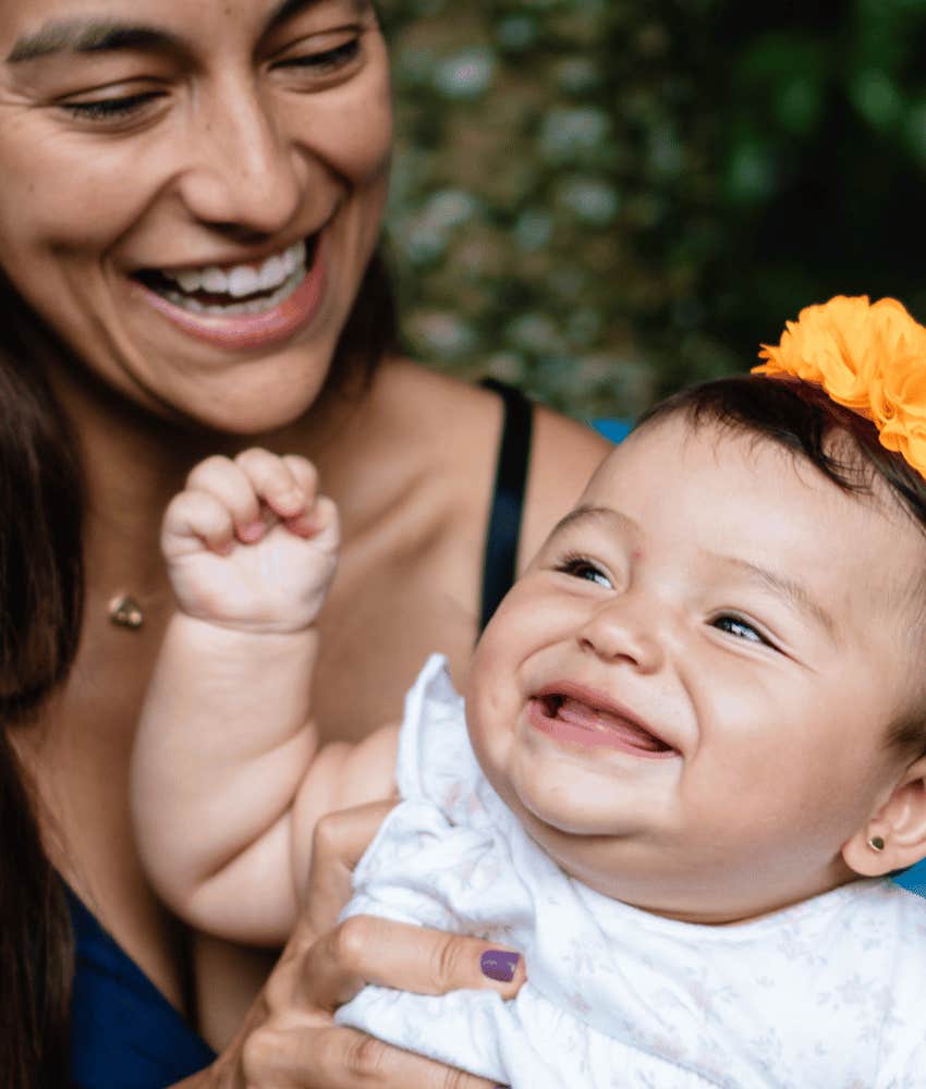 Happy mother knows she is shaping how infant will parent
