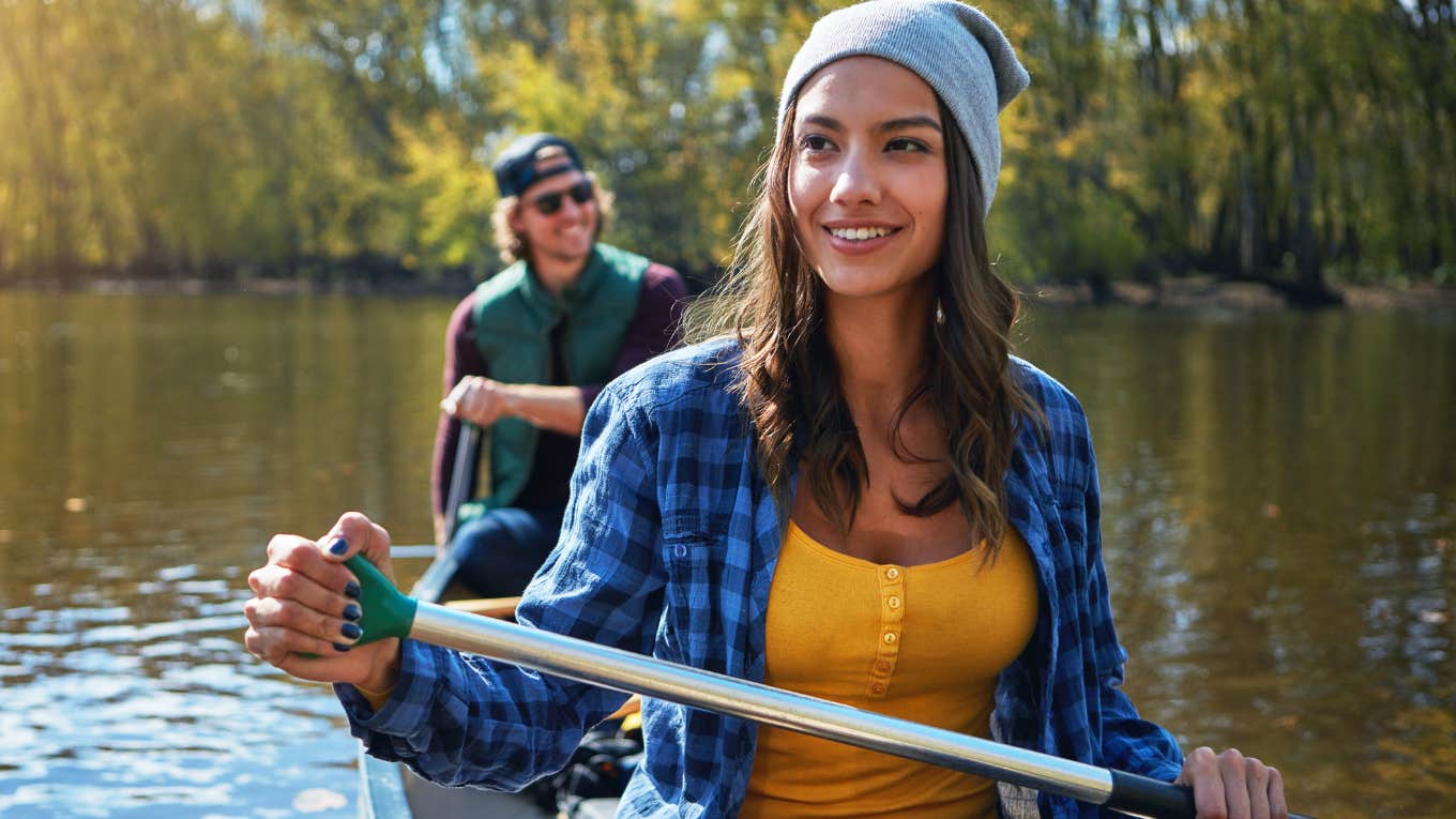 Woman fully experiencing life in a canoe even though she can't afford to travel
