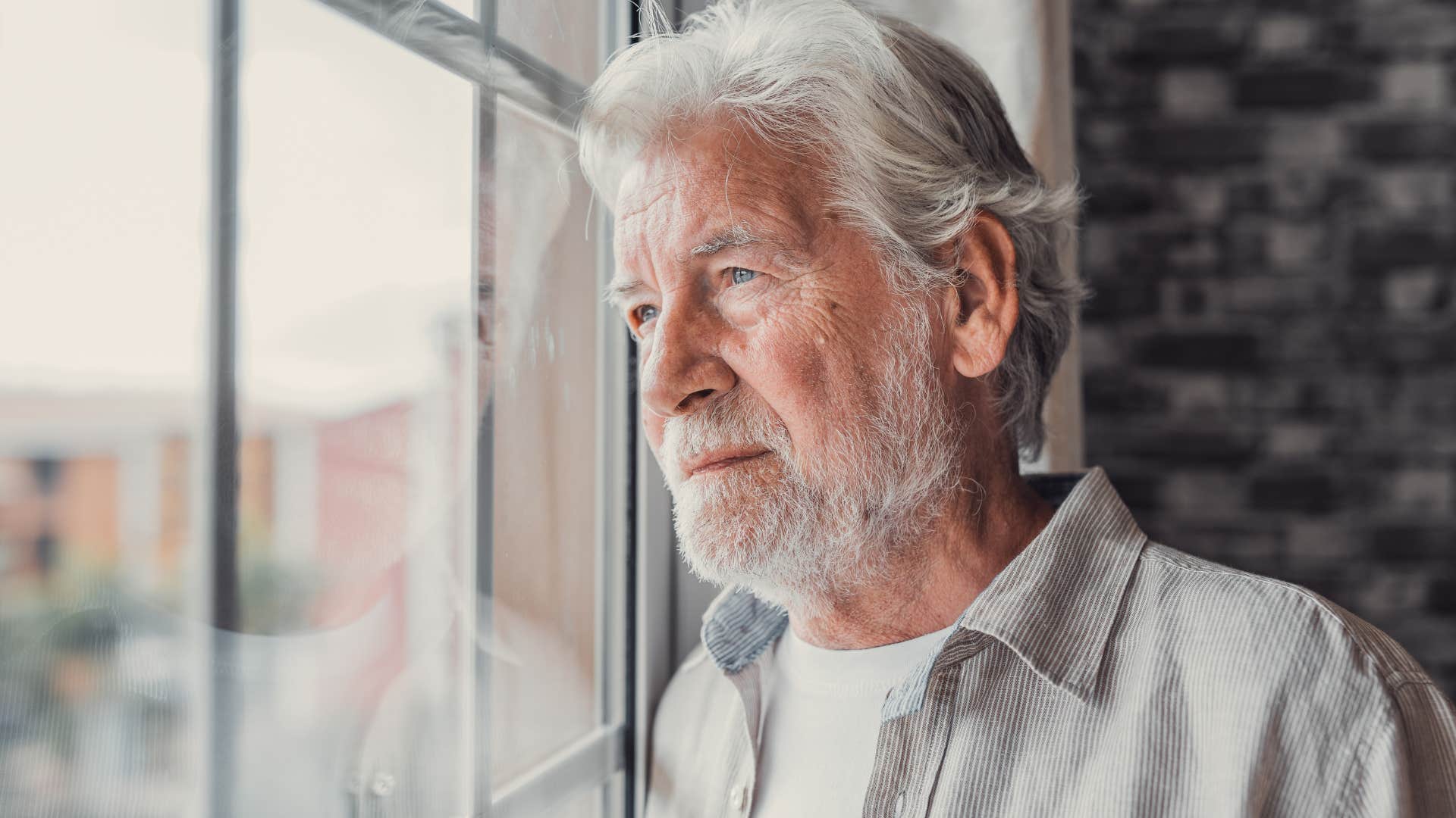 ungrateful man looking out his window