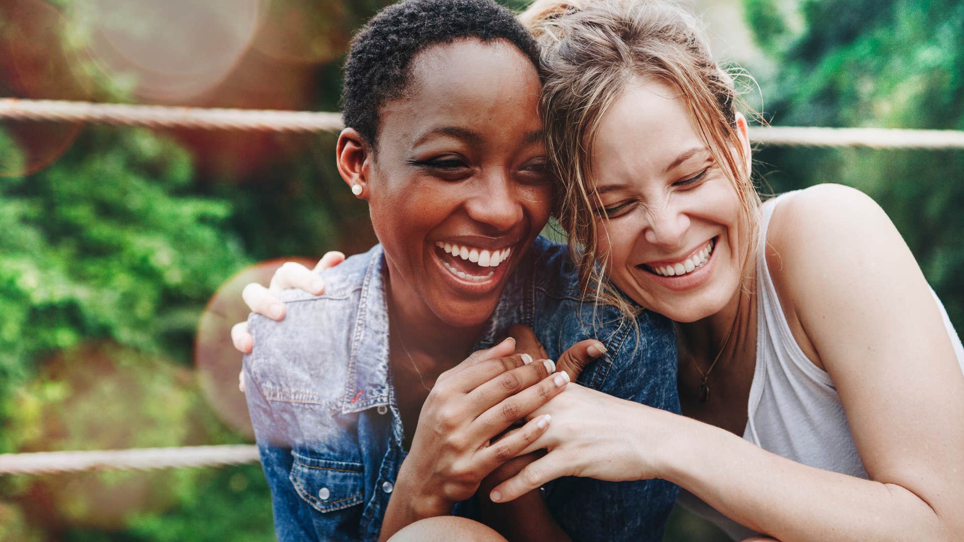 two women hugging and avoiding gossip