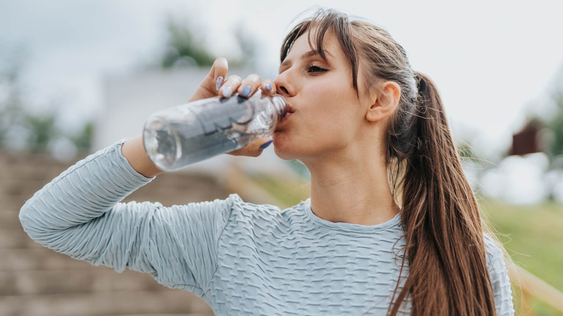 woman drinking more water for her mental health
