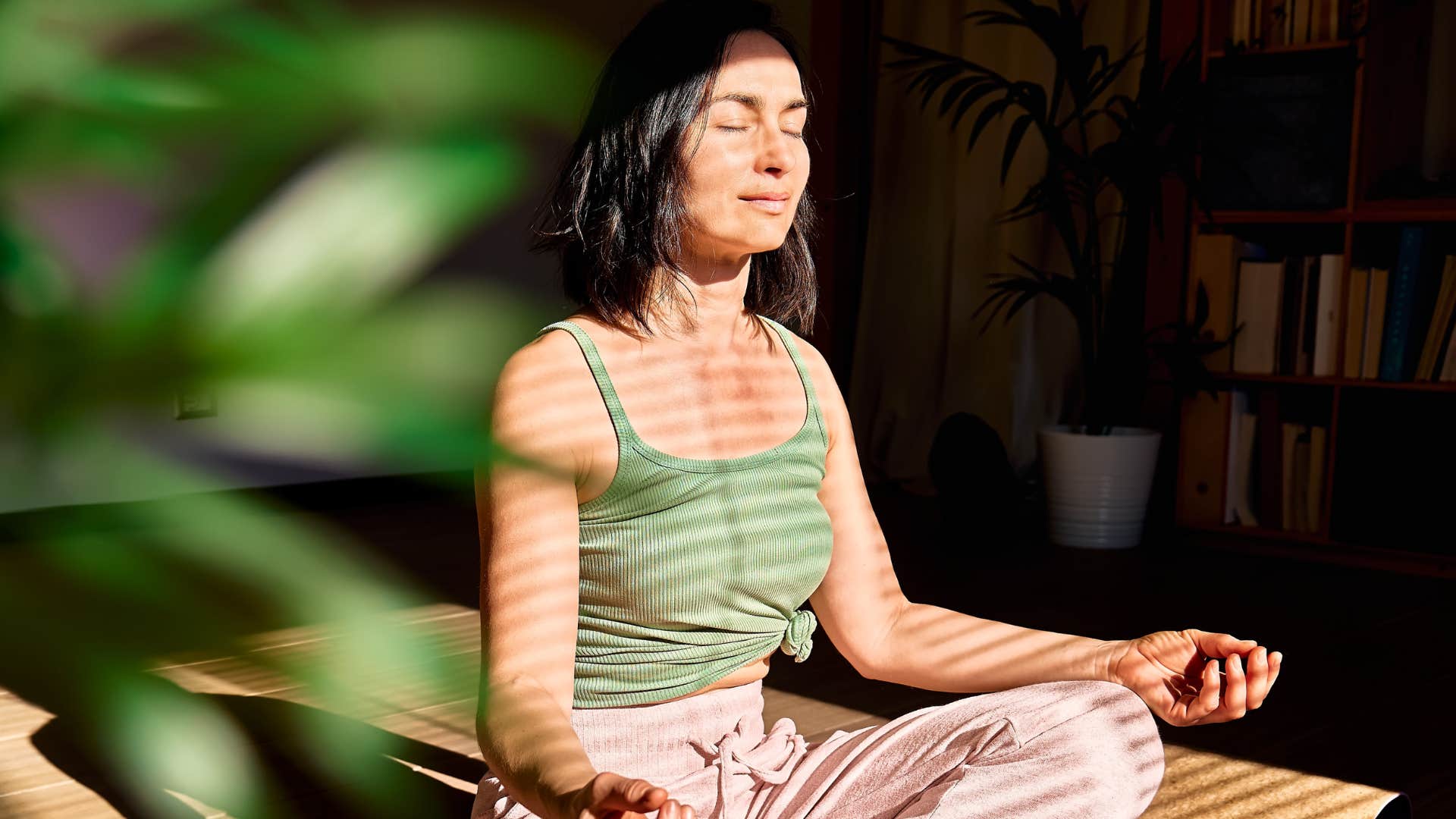 woman doing yoga practical movement for her mental health