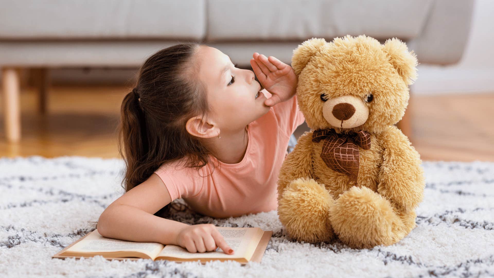 little girl whispering to imaginary friend