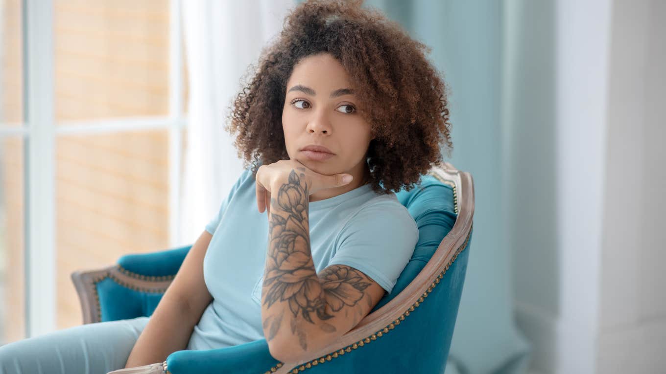 woman questioning if she should cover her tattoos for her boyfriend's family dinner
