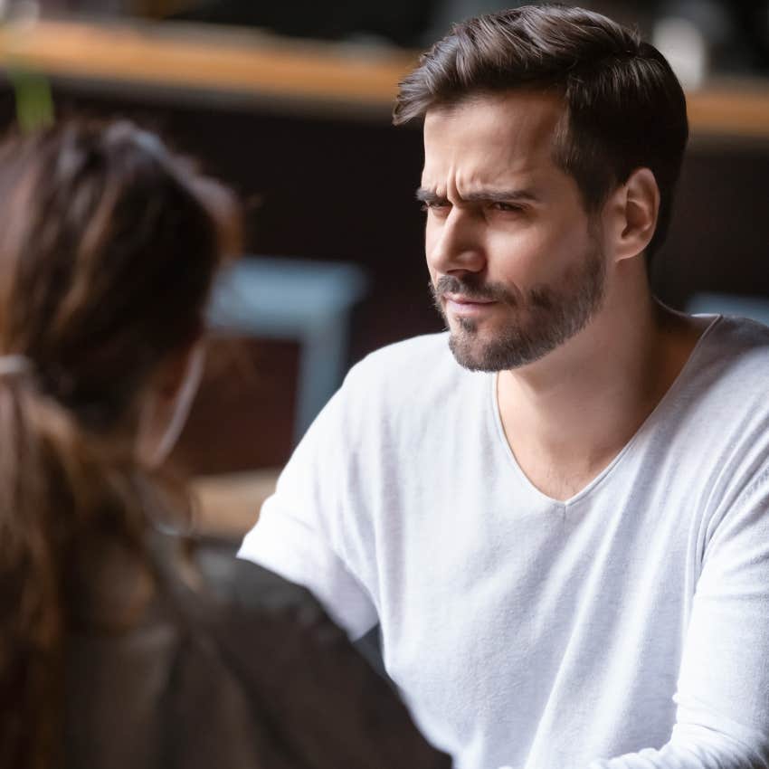 upset man across from unforgettable woman