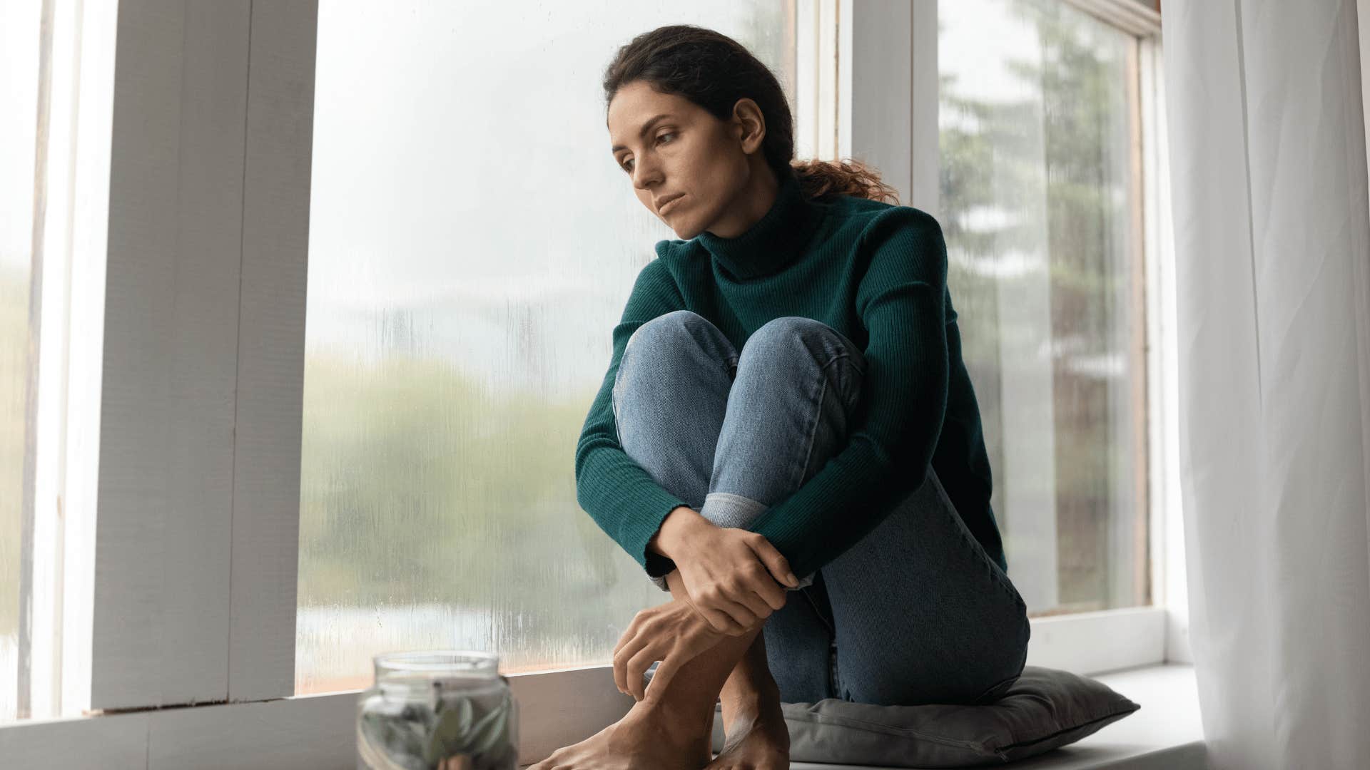woman sitting by the window