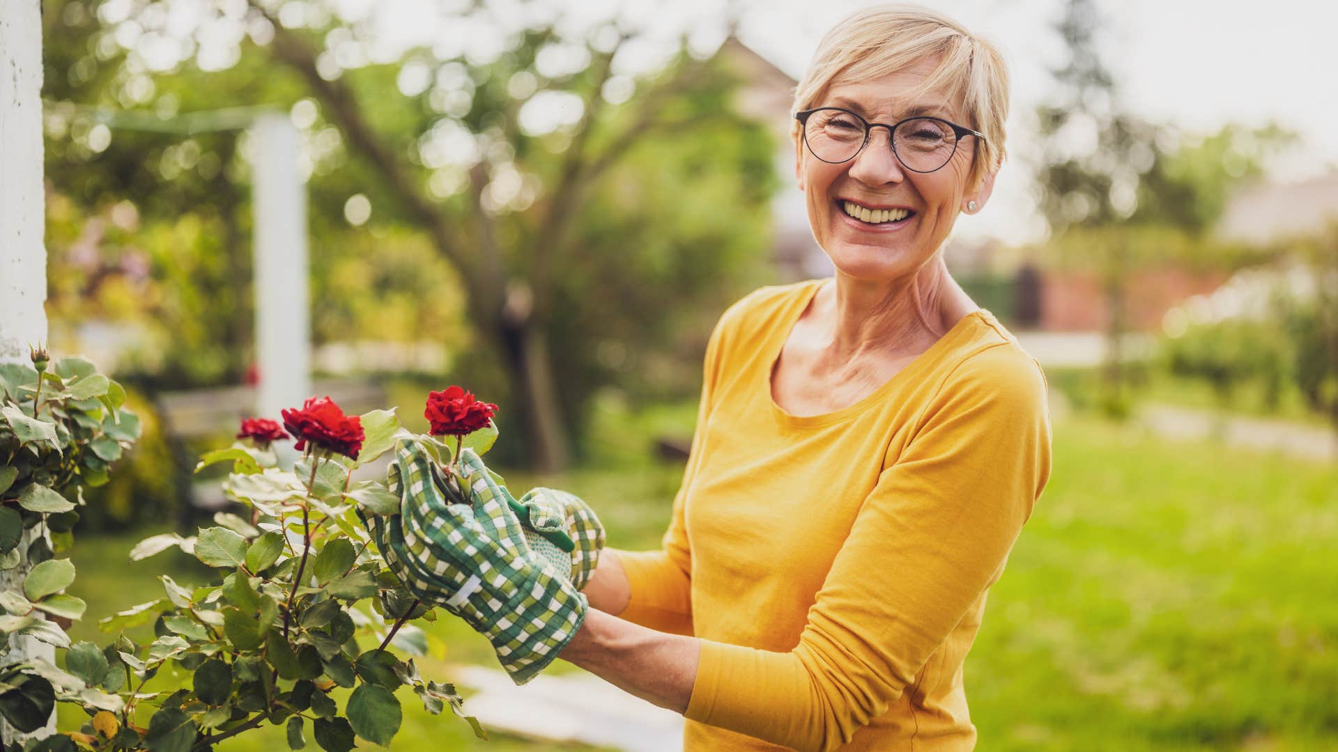 intelligent woman smiling and gardening