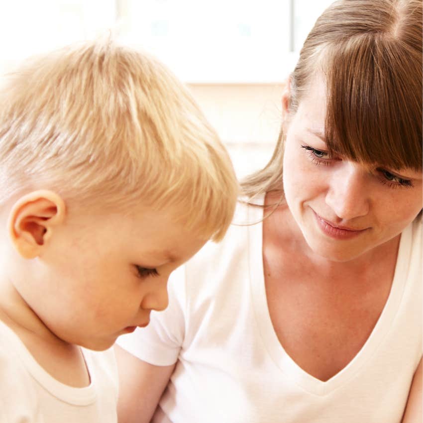 mother with young son teaching him words 
