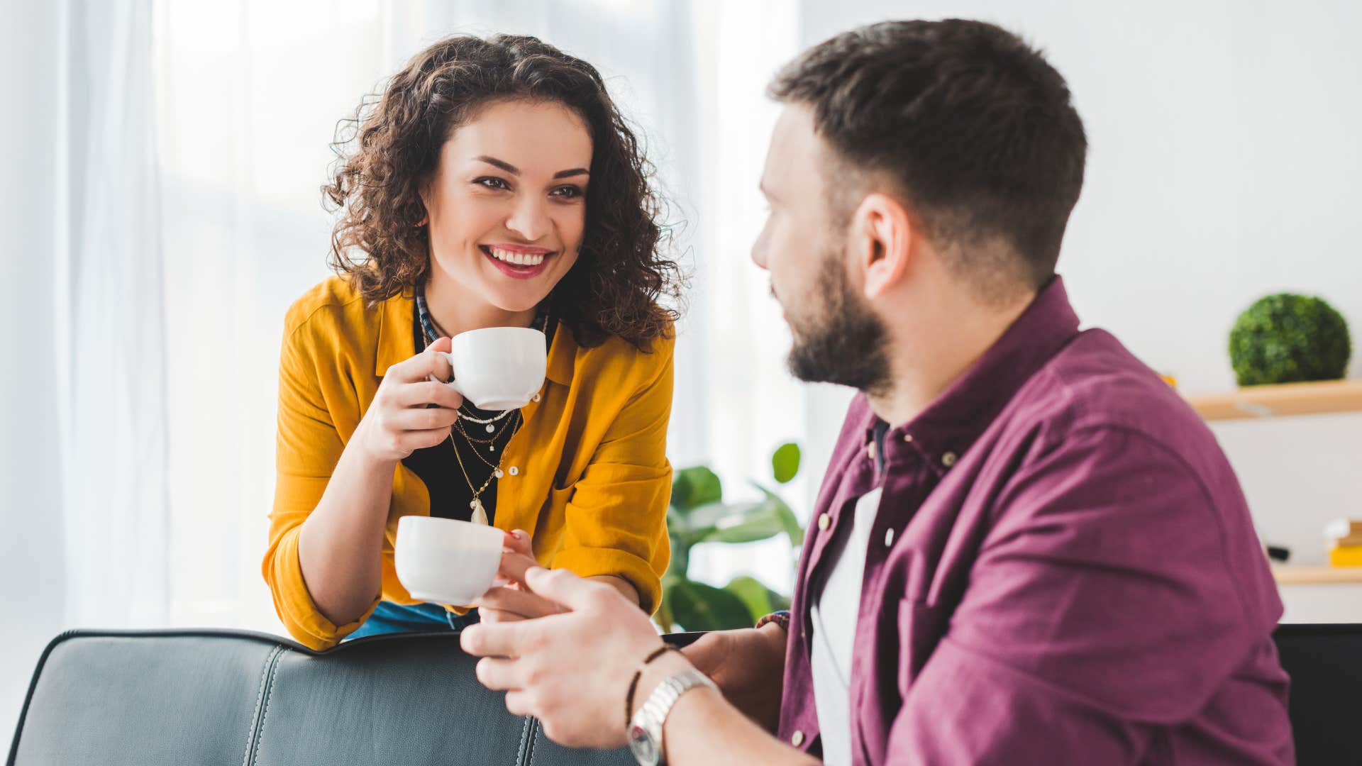 A husband shows appreciation for his wife making him a cup of coffee.
