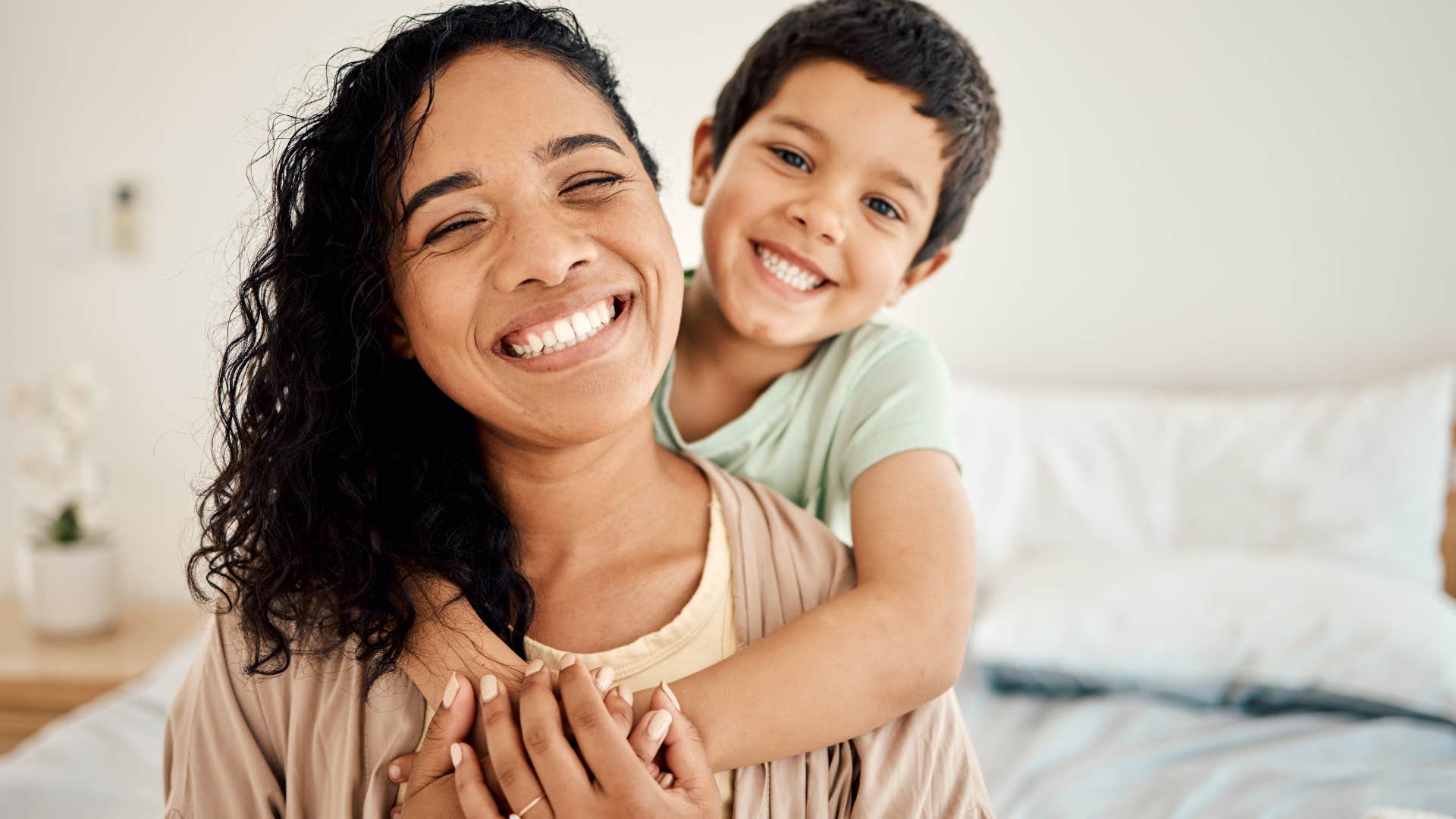 mom and little boy smiling on a weekend morning