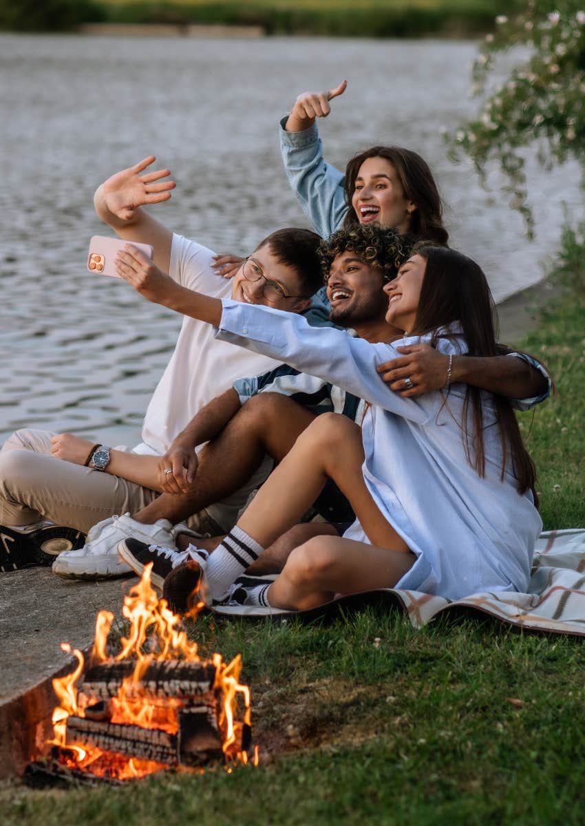 friends near bonfire boosting their relationship