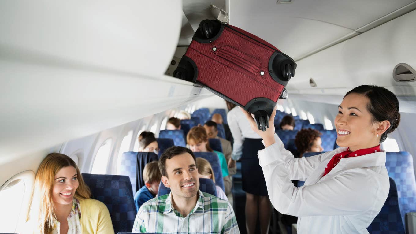 airline baggage fees sexist ryanair court case flight attendant putting bag in overhead bin