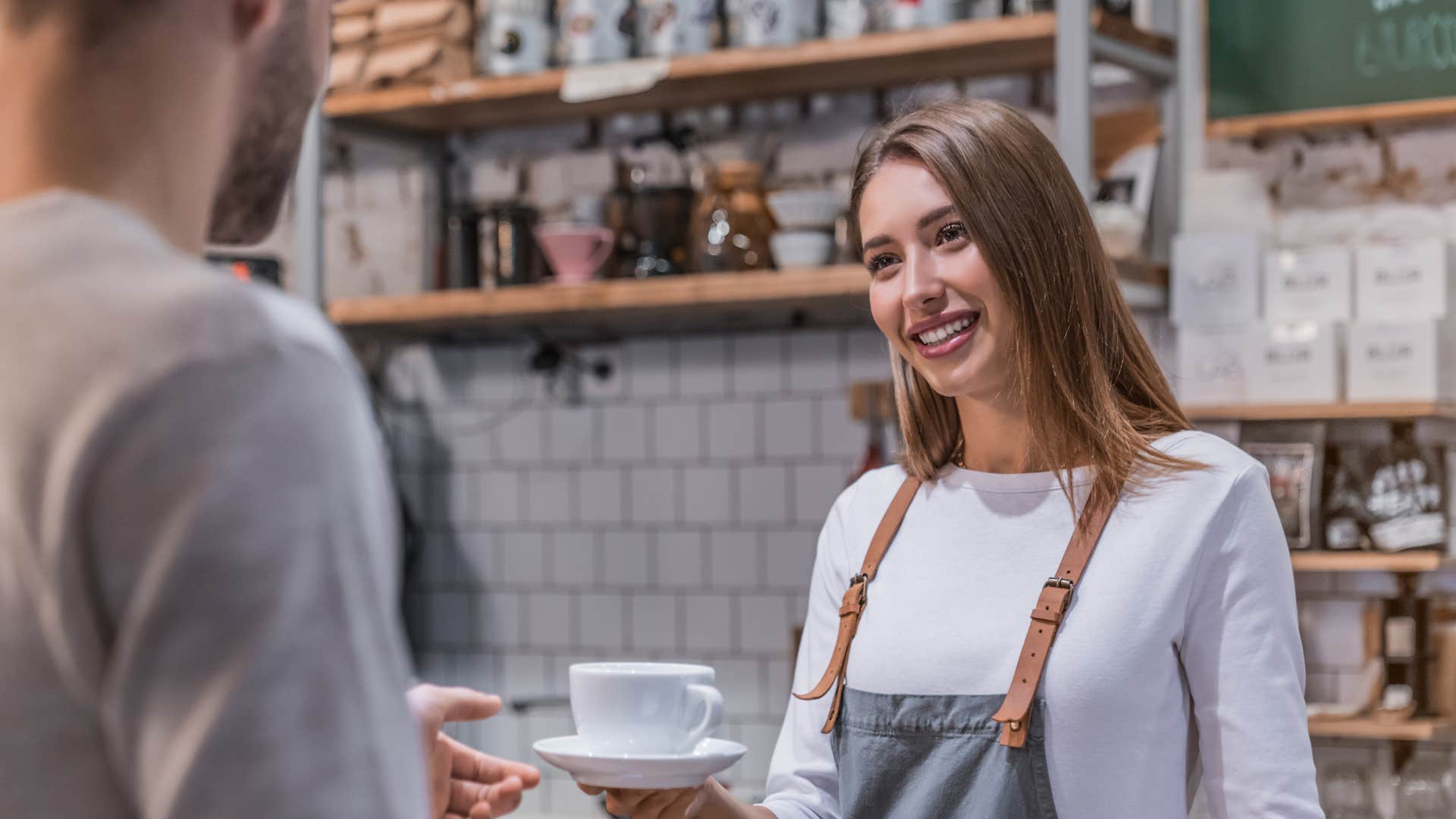 a man rushes his barista despite her talking to him