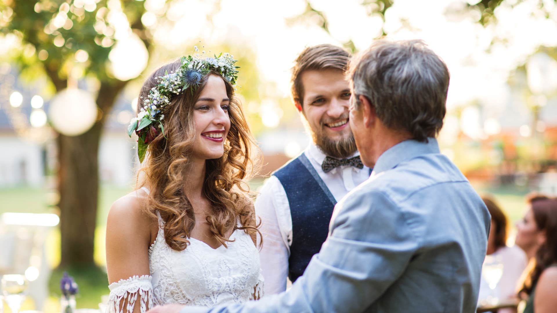 a groom and his new wife greet her uncle who he has never met before rudely at their wedding