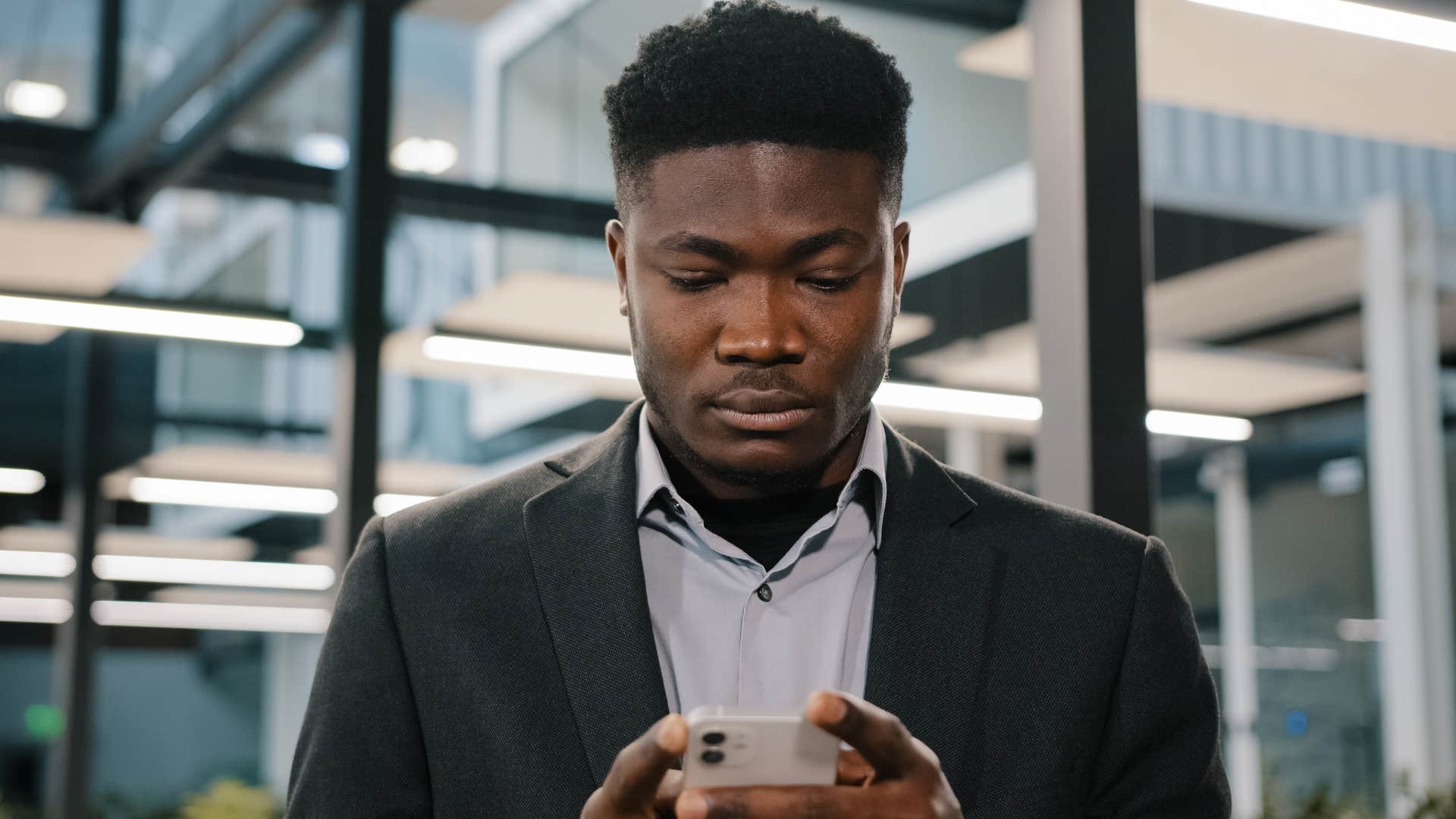 a man reads his significant others long text message breaking up with him while he is working