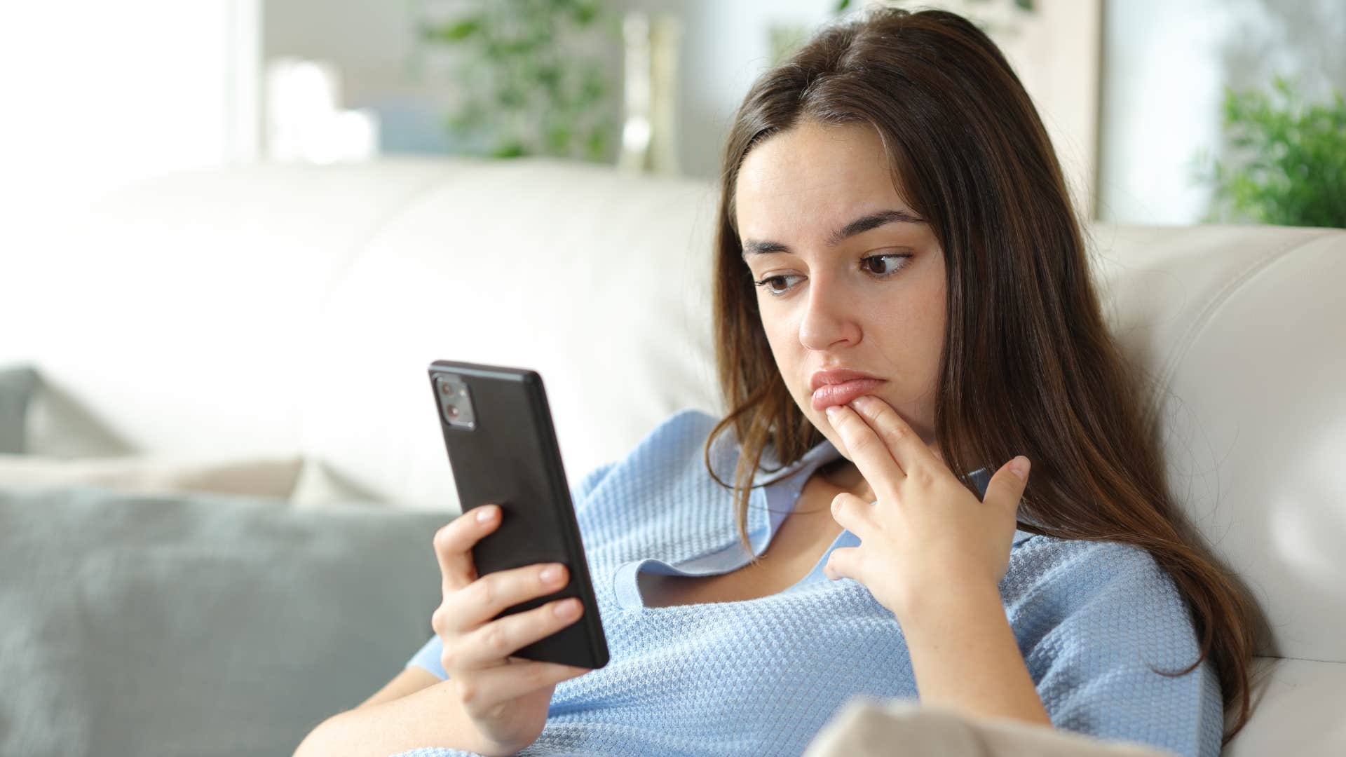 a young woman finds her friends all caps text messages to be weird