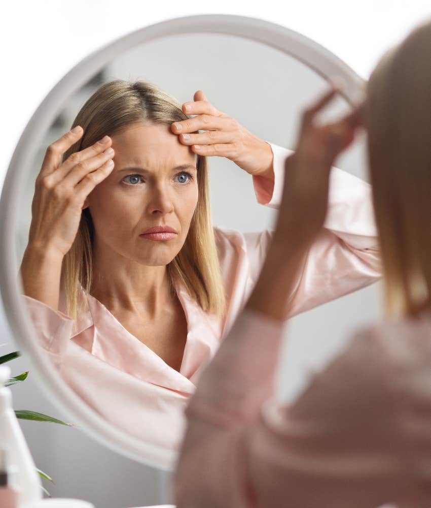 woman judging her own appearance far more harshly than others