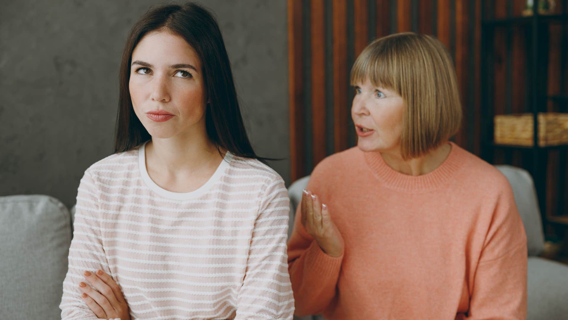 woman giving adult daughter a backhanded compliment offending her