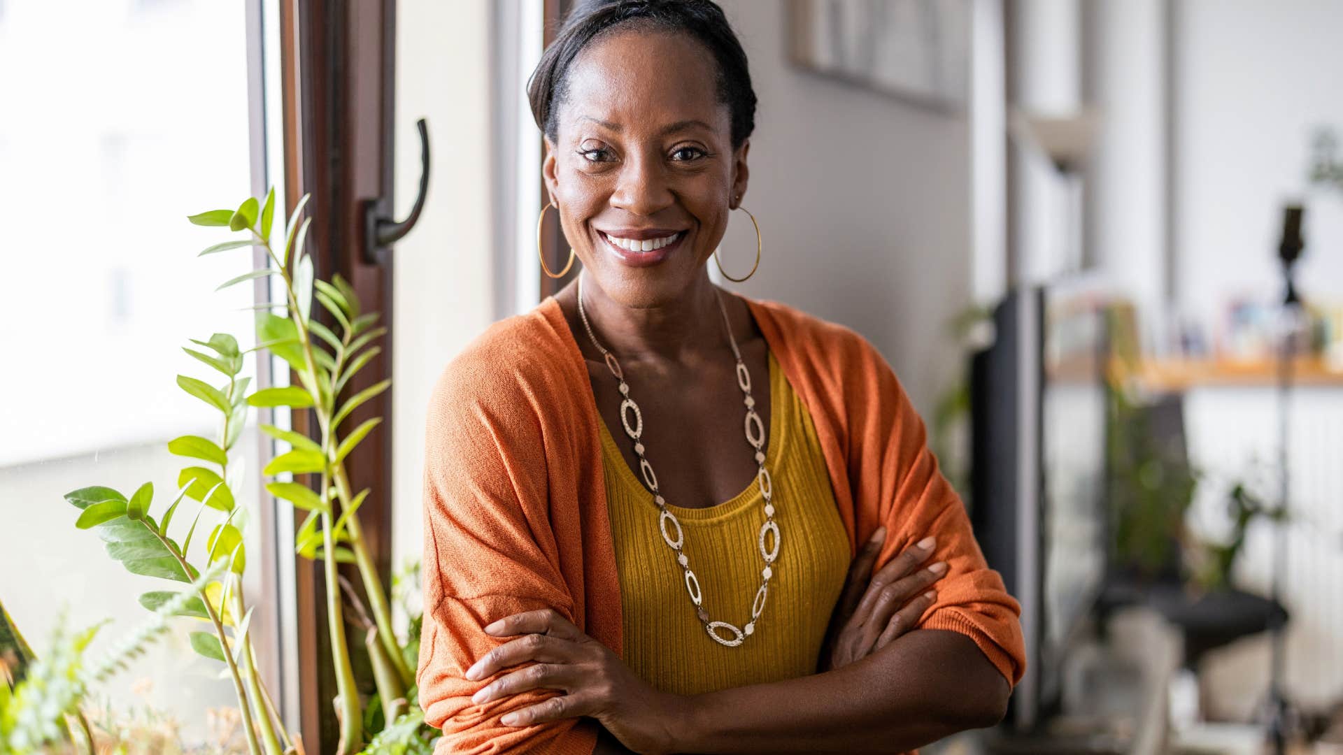 Woman who takes accountability for mistakes smiling at the camera.