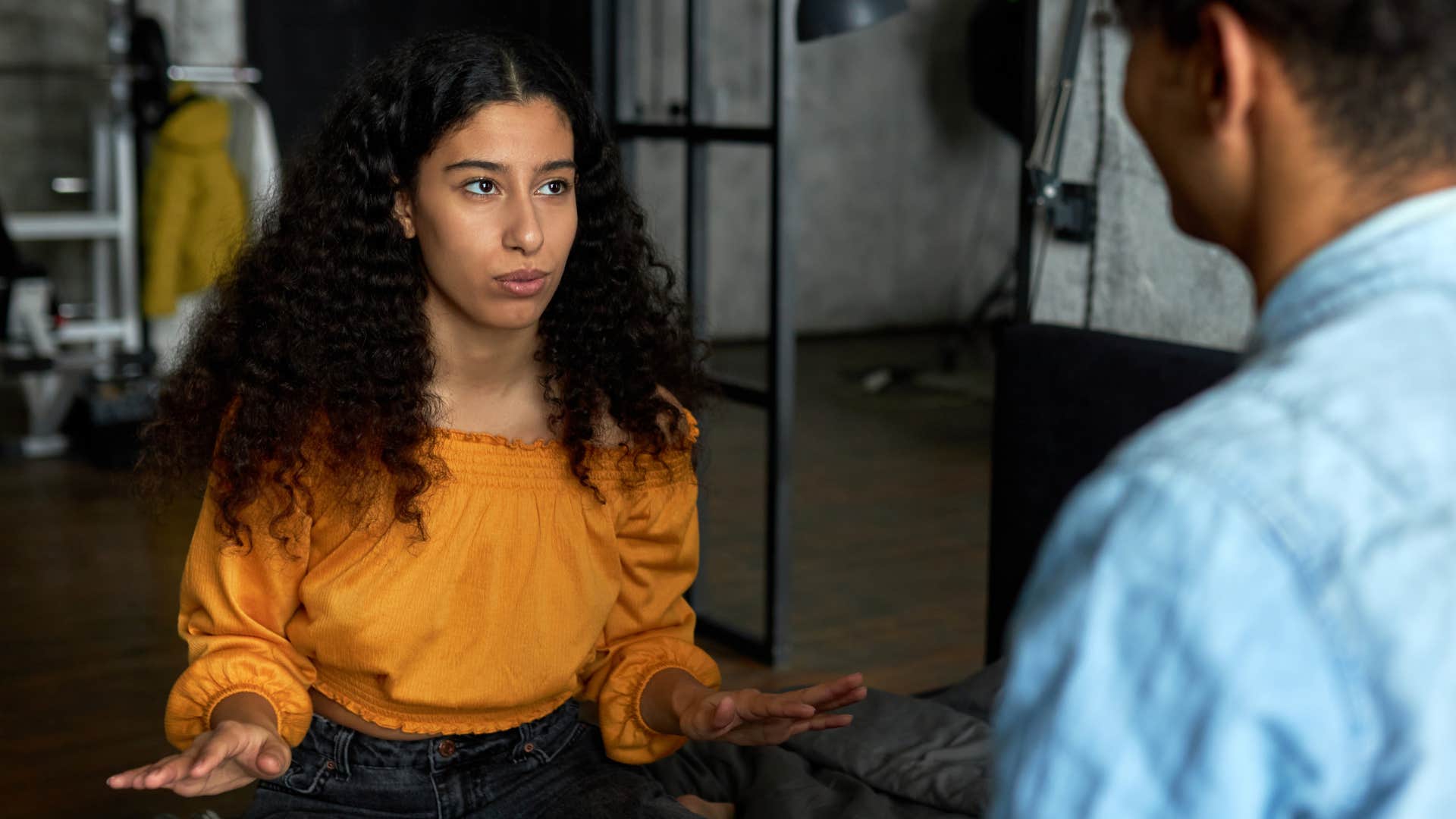Woman who can end relationships that don't serve them talking to her partner.