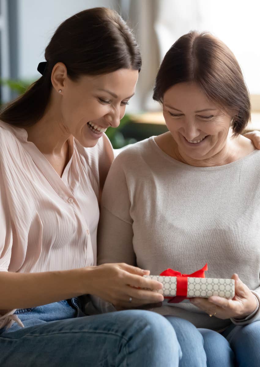 happy woman giving a generous gift to her mother