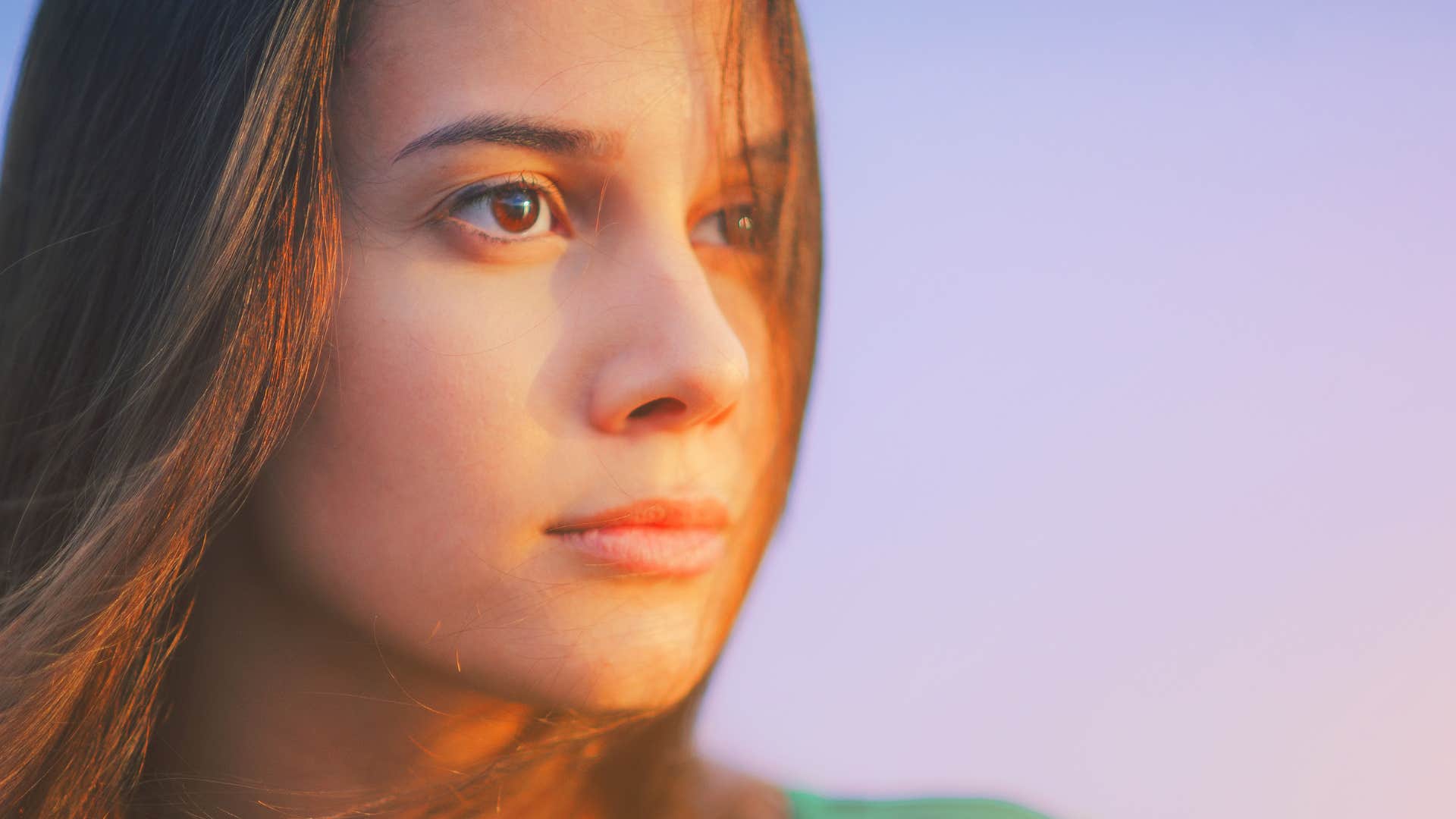 a woman surrounds herself with soft energy in her life