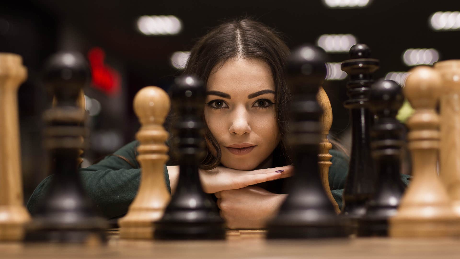 a woman is overly competitive when playing a game of chess